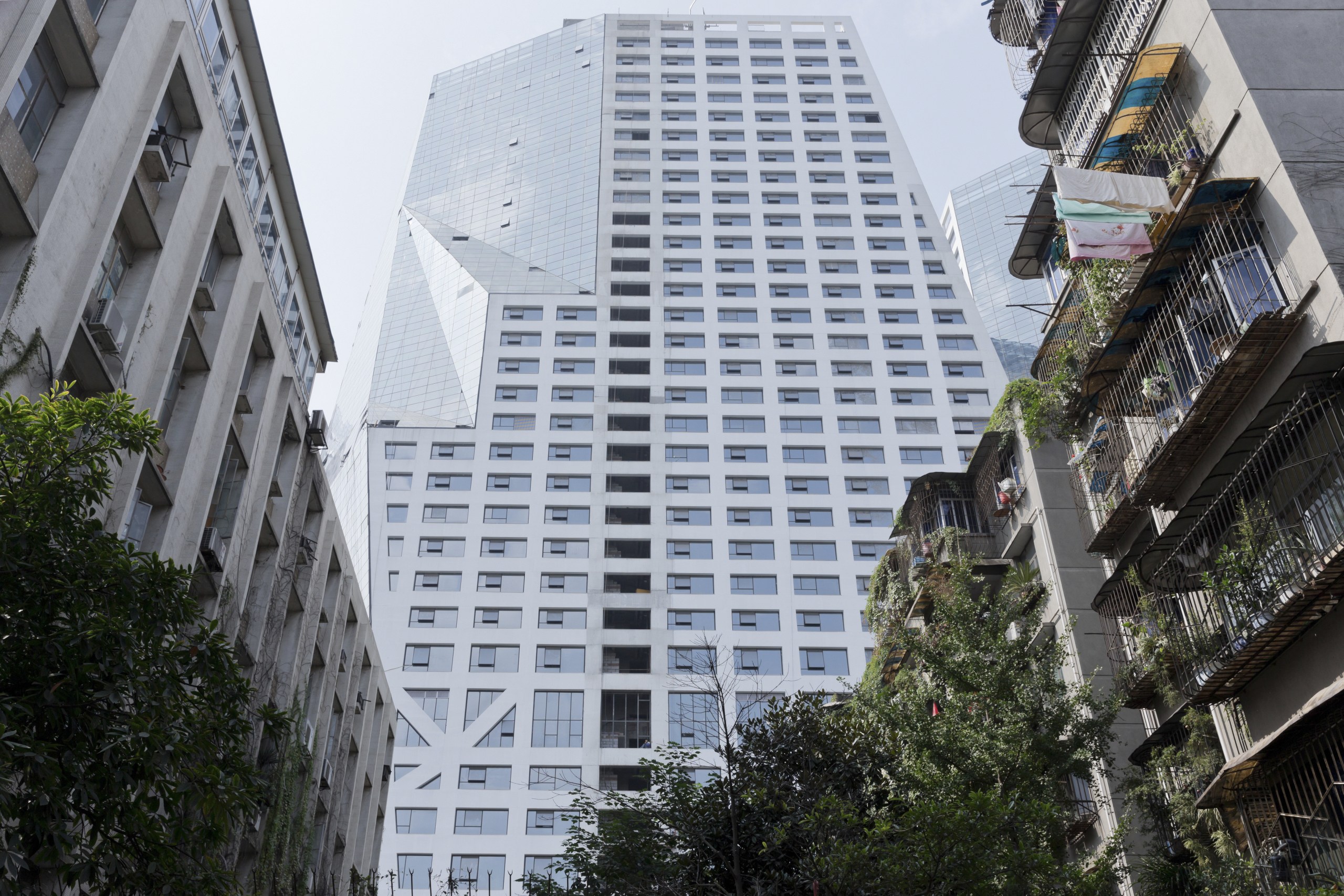 Raffles City Chengdu by Steven Holl Architects - apartment, architecture, building, city, condominium, corporate headquarters, daytime, downtown, facade, metropolis, metropolitan area, neighbourhood, real estate, residential area, sky, skyscraper, tower block, tree, urban area, gray, black