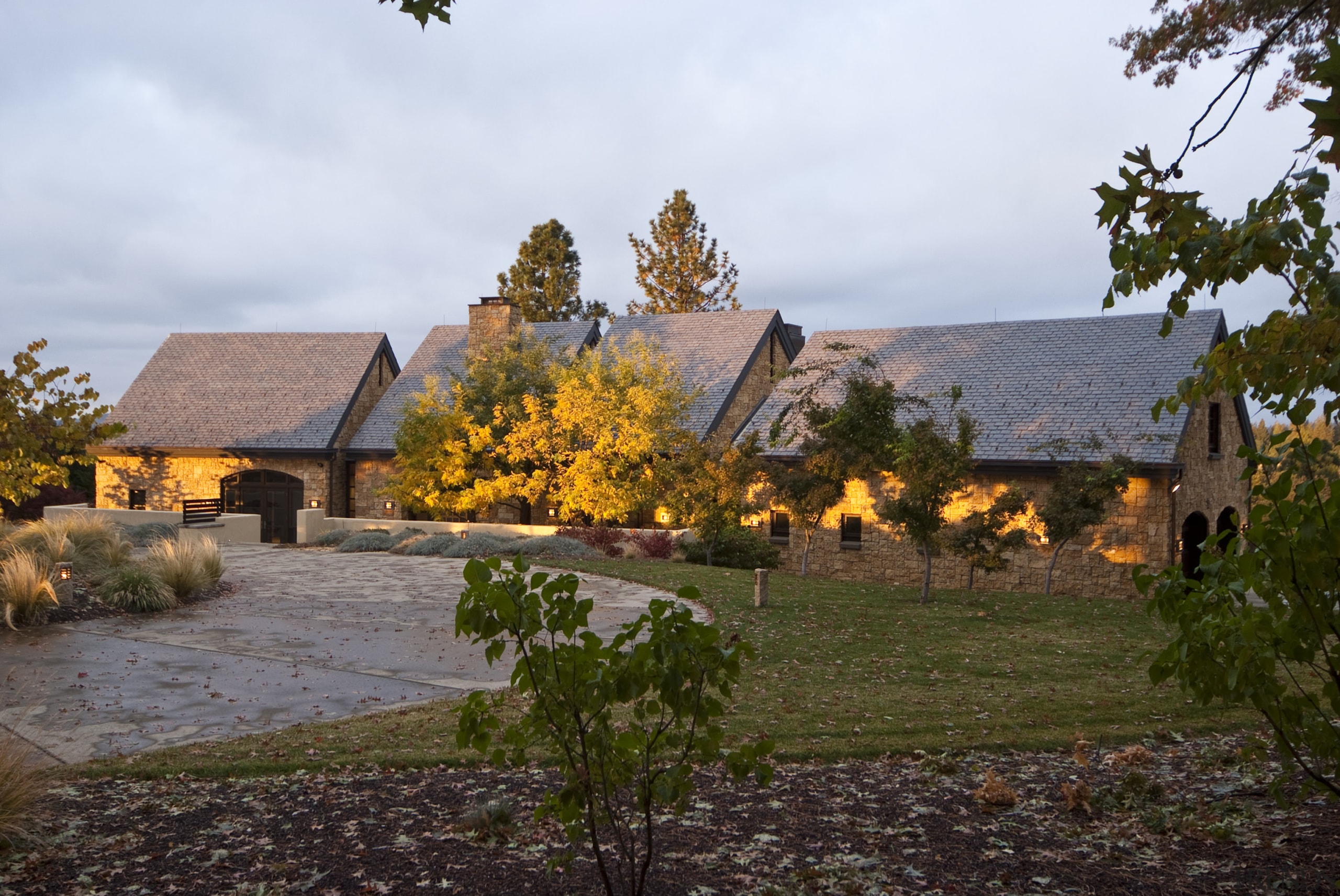 Low stucco walls enclose this new country house, autumn, cottage, estate, home, house, landscape, leaf, plant, property, real estate, rural area, sky, tree, village, white, brown
