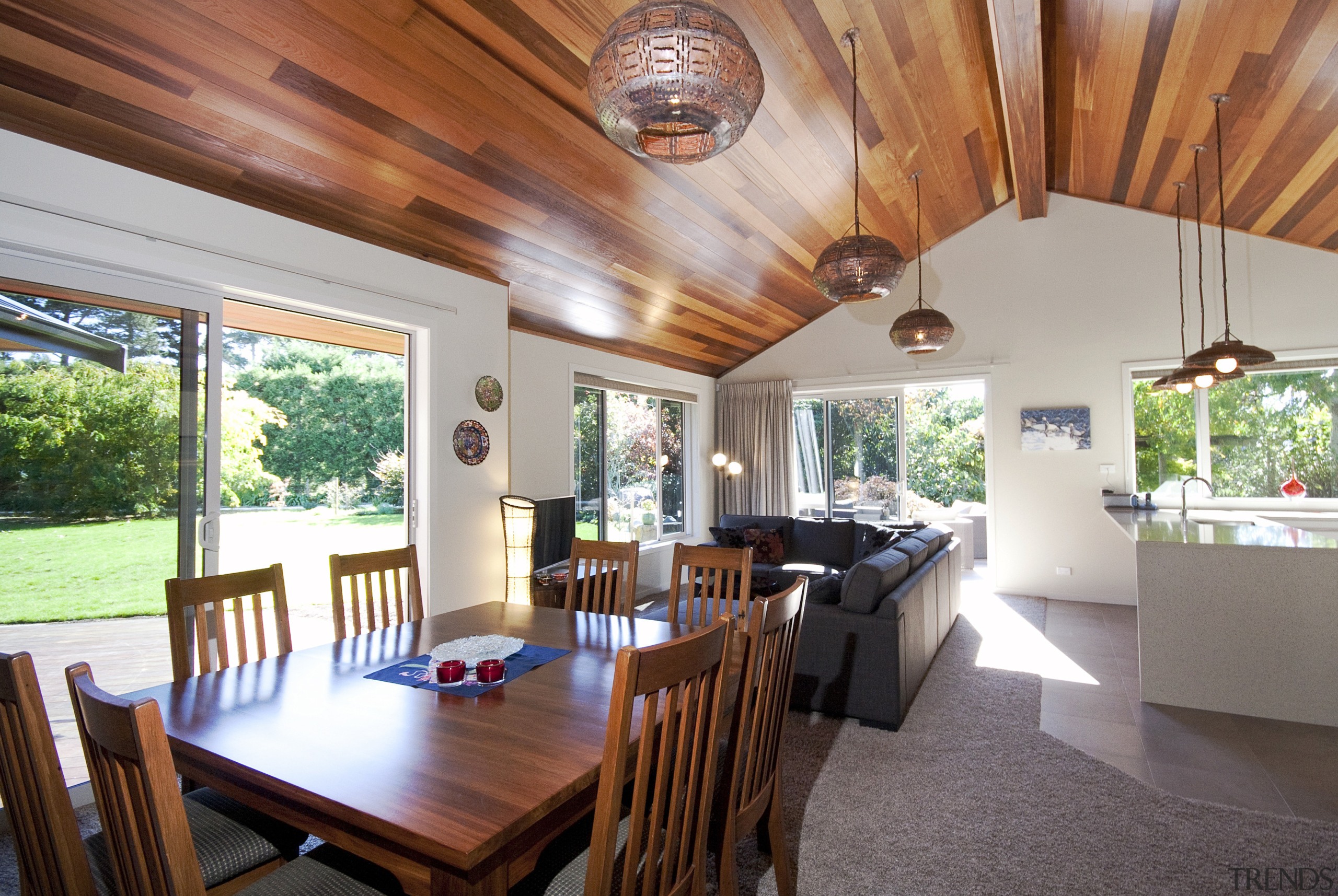 A raked cedar ceiling adds visual warmth, and ceiling, dining room, estate, home, house, interior design, property, real estate, table, gray
