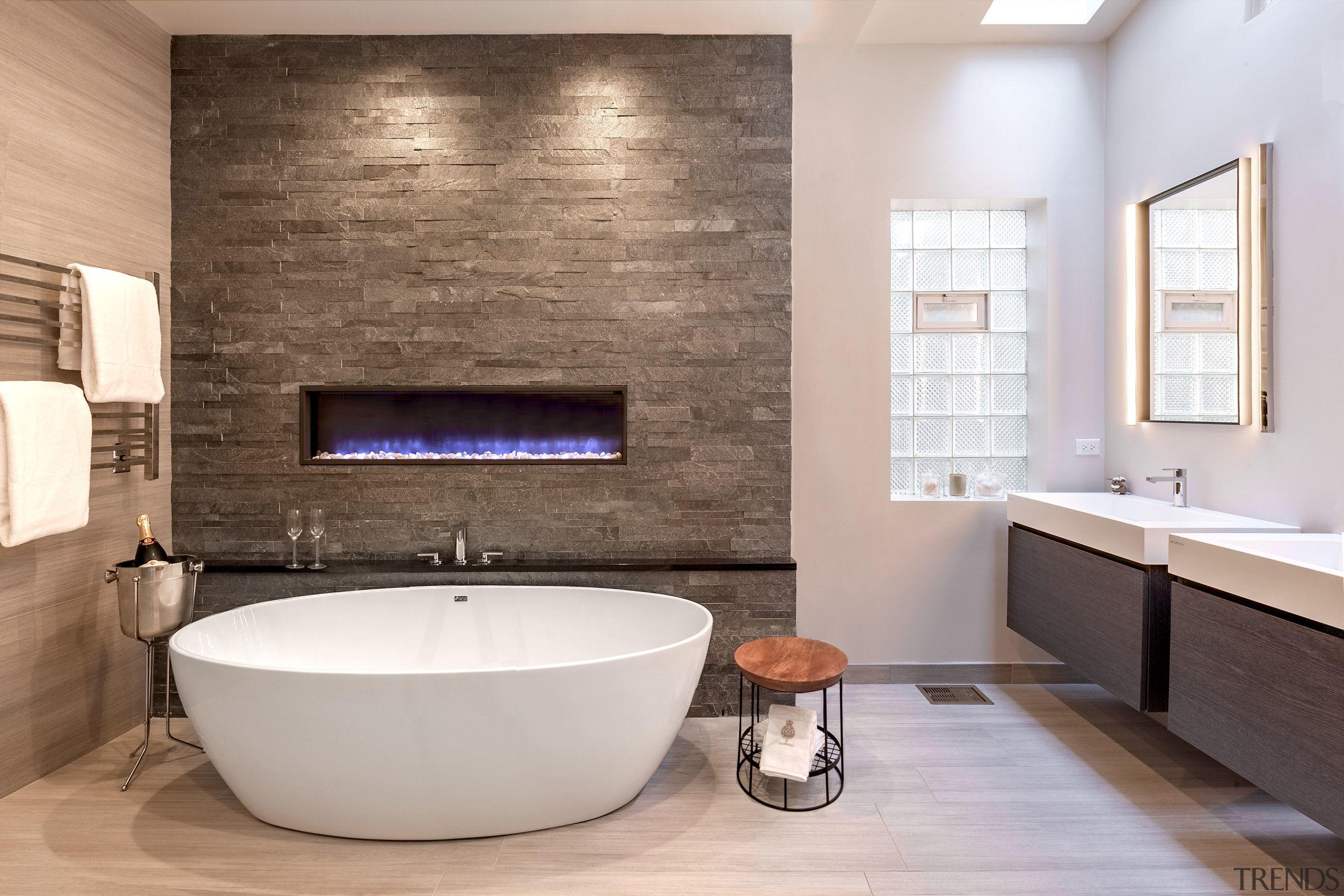 Stone-look tiles, an enclosed gas fire that changes bathroom, countertop, floor, flooring, home, interior design, plumbing fixture, room, sink, tap, tile, wall, gray