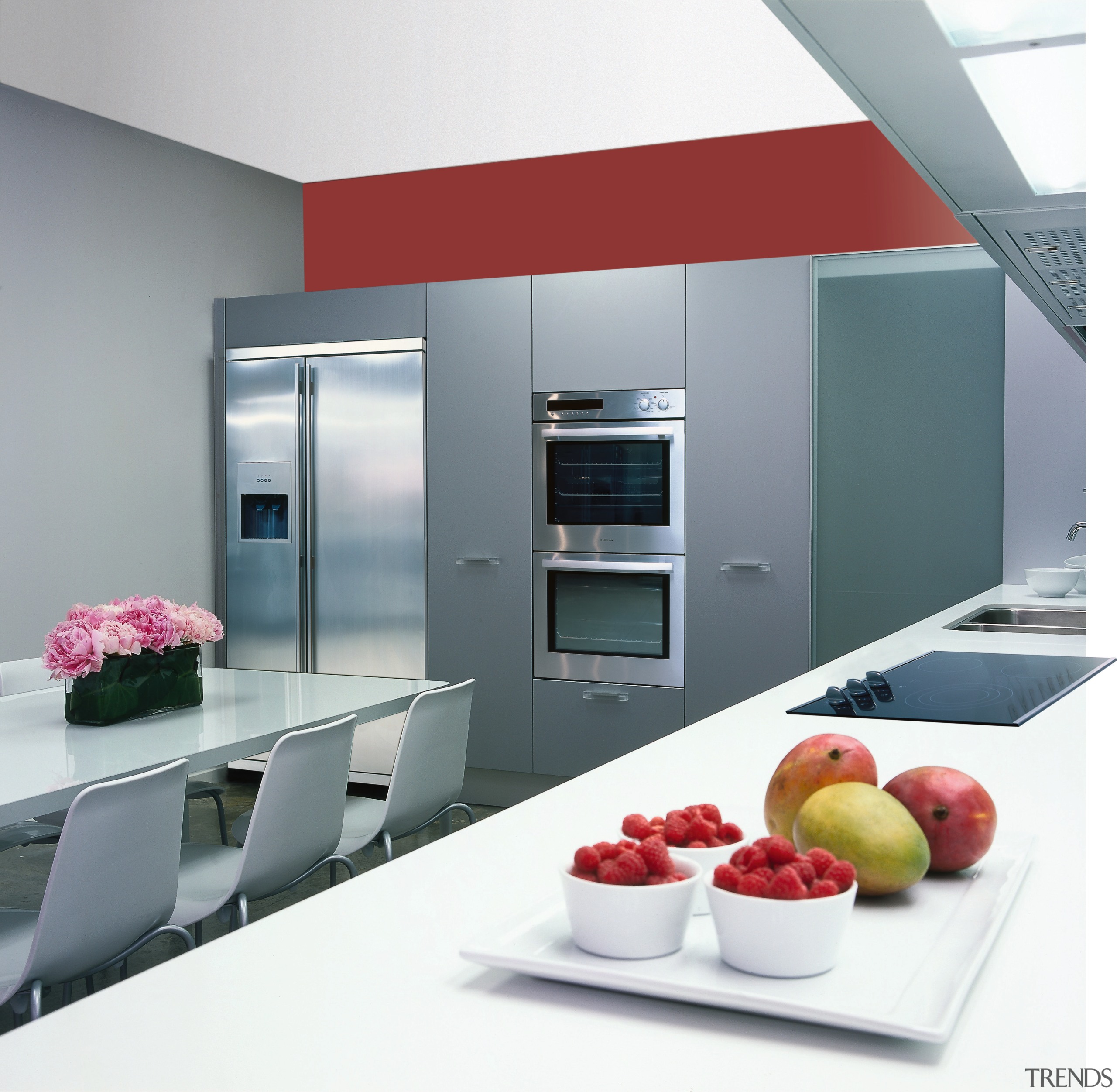 Showroom kitchen with light grey cabinetry and red countertop, home appliance, interior design, kitchen, product, product design, gray, white