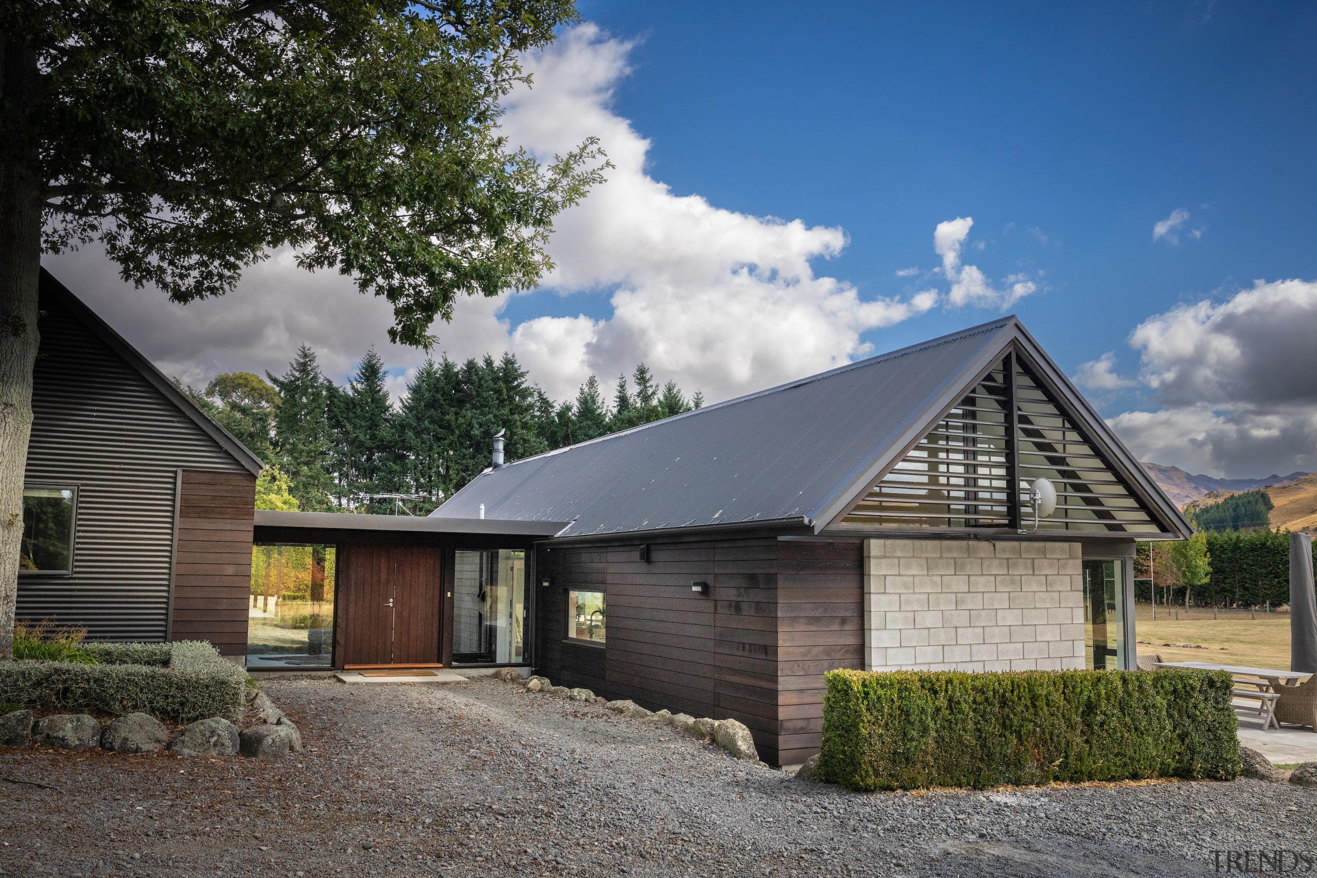 Timber cladding and an existing corrugated iron roof 