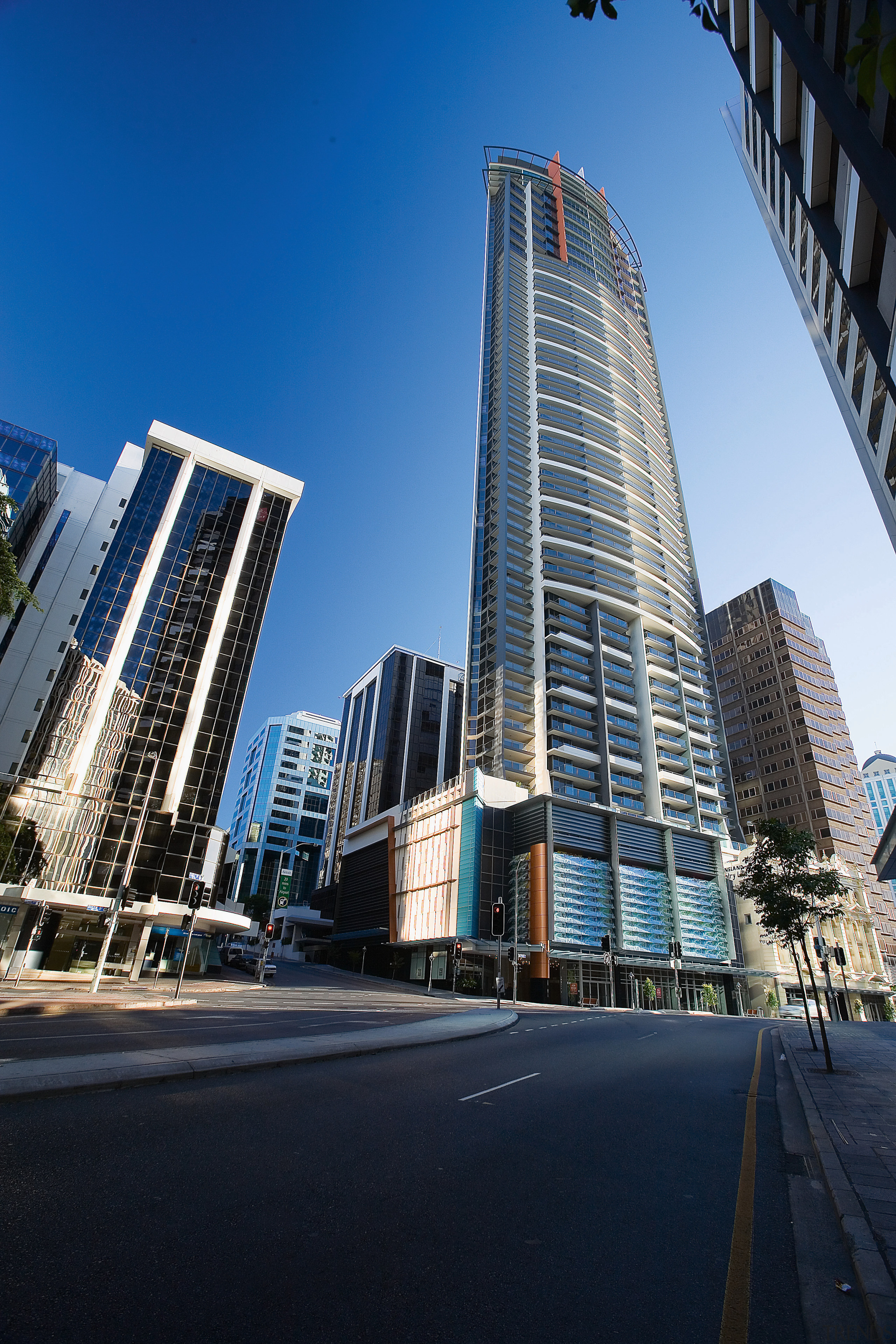 Exterior view of cityscape and tall apartment building. architecture, building, city, cityscape, commercial building, condominium, corporate headquarters, daytime, downtown, facade, headquarters, infrastructure, landmark, metropolis, metropolitan area, mixed use, neighbourhood, real estate, residential area, sky, skyline, skyscraper, tower, tower block, urban area, black
