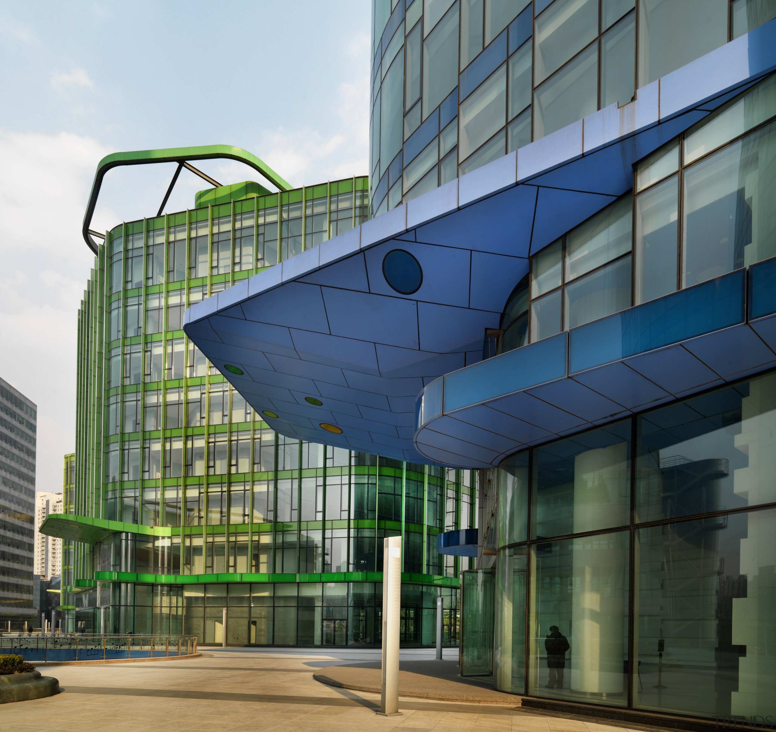 View of the Shanghai International Cruise Terminal. architecture, building, commercial building, condominium, convention center, corporate headquarters, daylighting, daytime, facade, glass, headquarters, metropolis, metropolitan area, mixed use, residential area, sky, structure