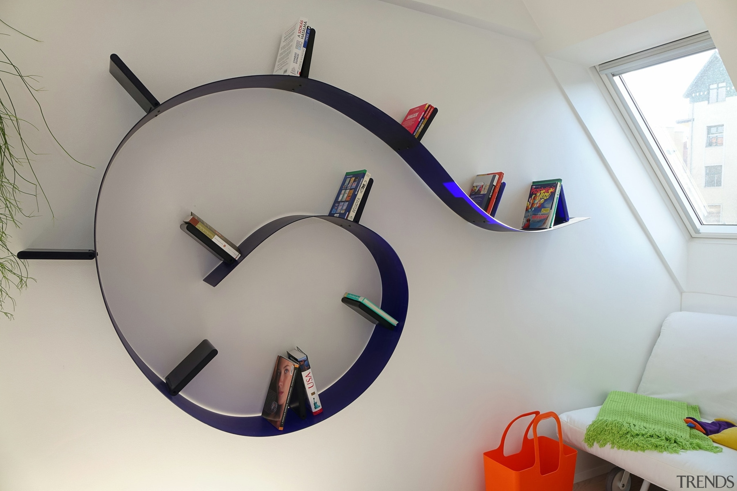 Spiral bookshelf in colourful Budapest apartment by Margeza clock, furniture, shelf, gray