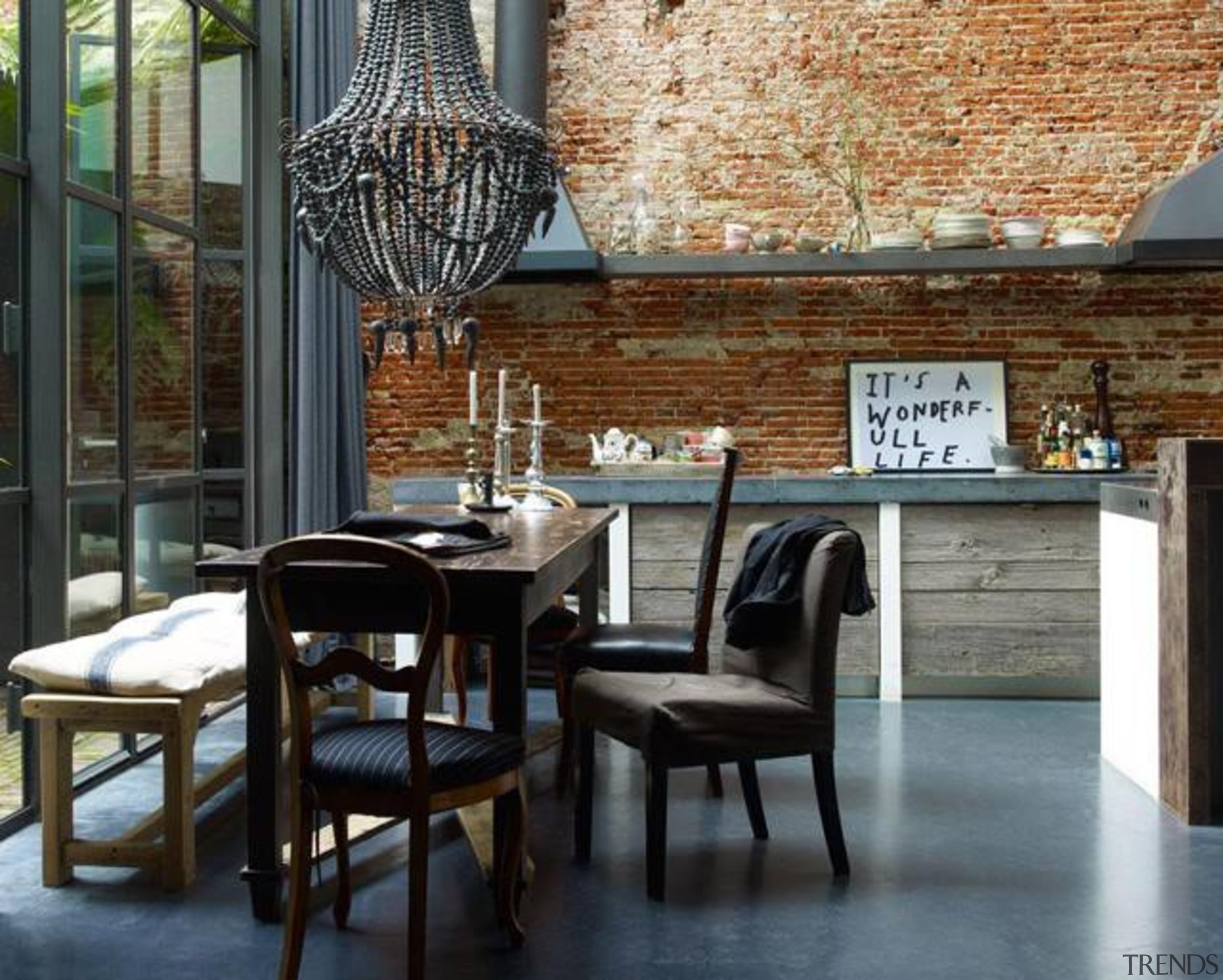 Red bricks + Luxurious Chandelier + Concrete = architecture, chair, dining room, furniture, interior design, table, black, gray