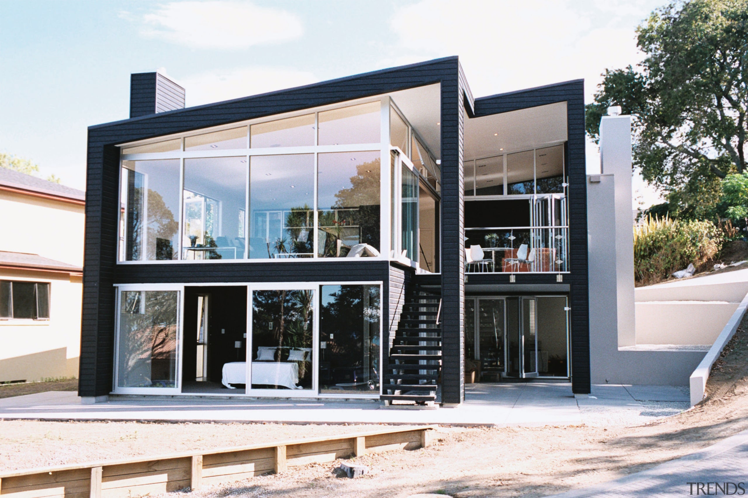 Exterior frontage of house with extensive glazing and architecture, door, facade, house, real estate, window, white