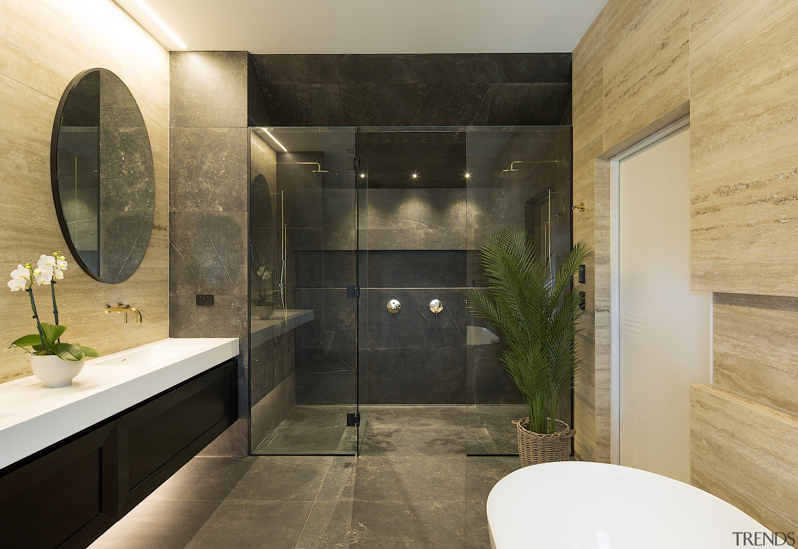 The warm materials and finishes in this bathroom 