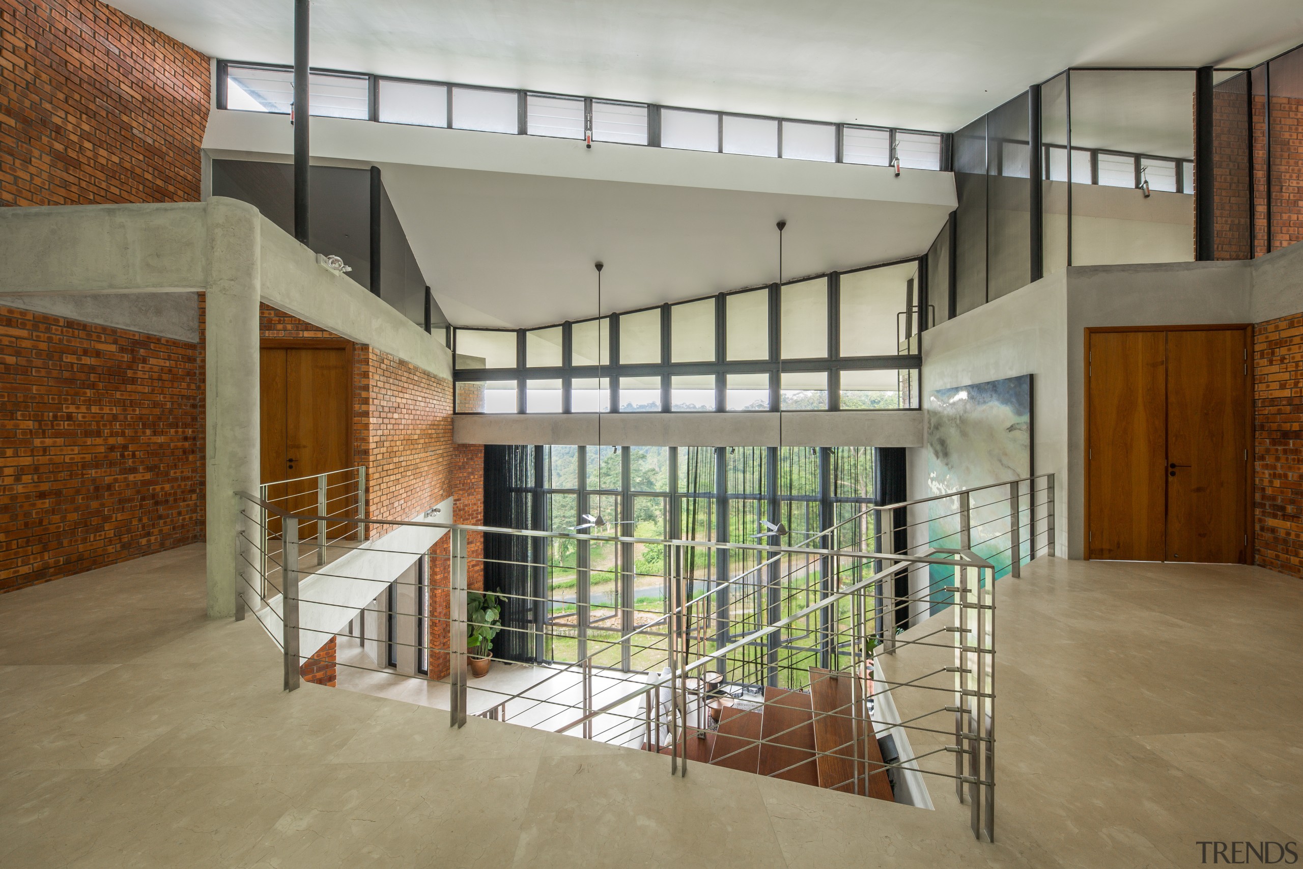 The dramatic entrance to the 5-bedroom home. Light apartment, architecture, building, ceiling, daylighting, design, estate, floor, flooring, hall, handrail, home, house, interior design, loft, property, real estate, residential area, room, stairs, window, gray, brown