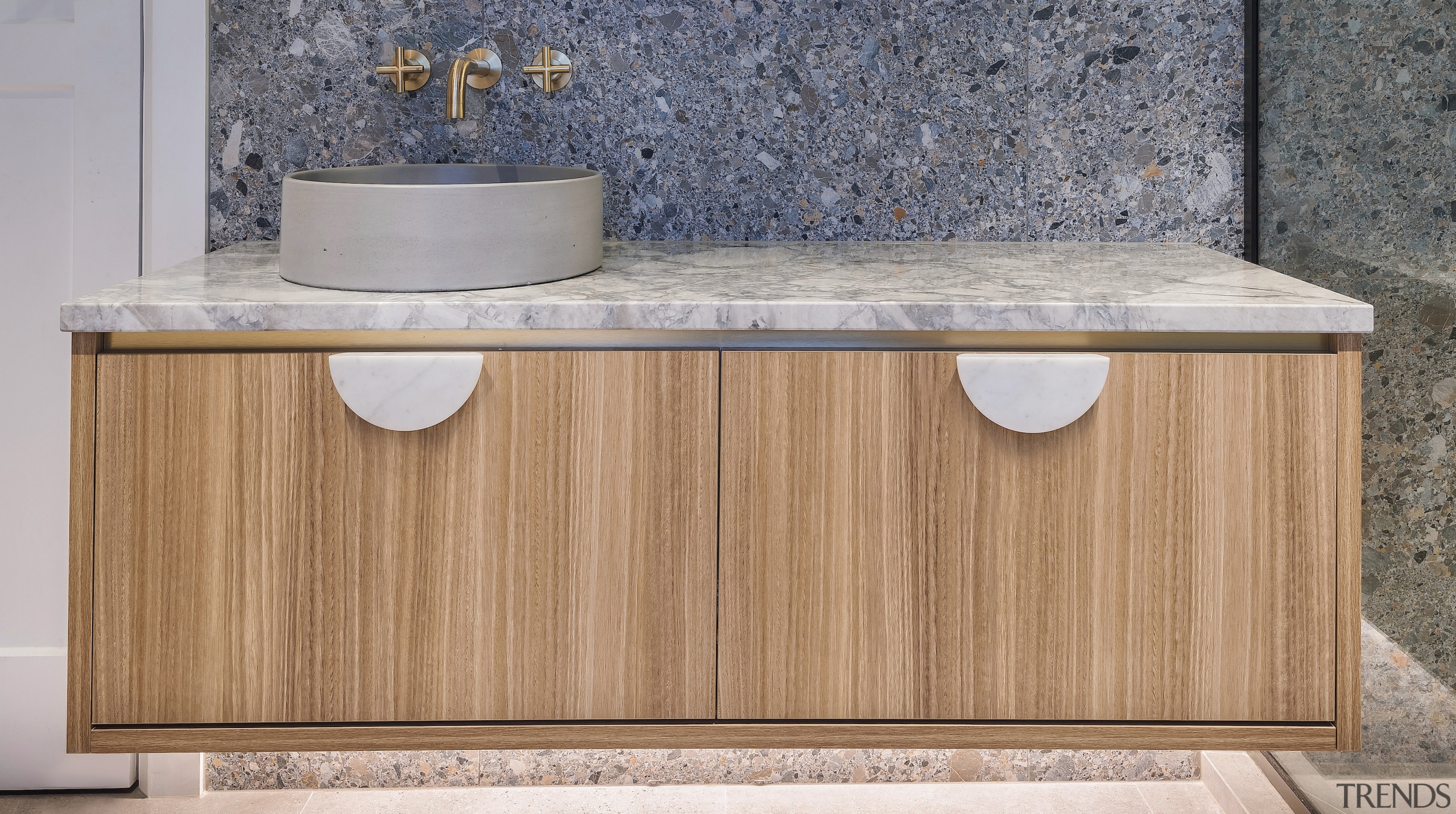 Marble vanity handles connect with the marble benchtop. 