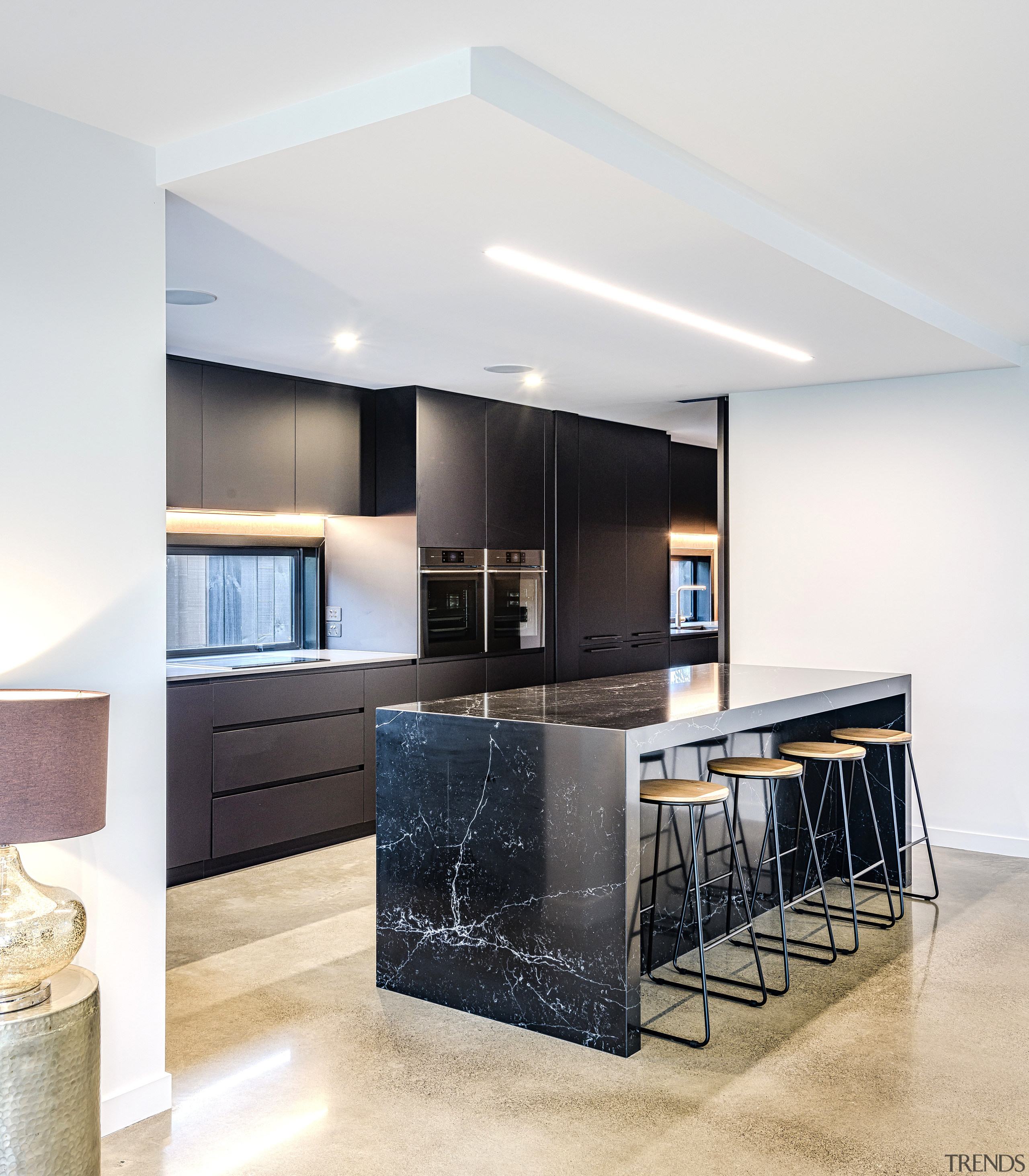 The new kitchen is not short on casual apartment, architecture, bar stool, building, cabinetry, ceiling, countertop, design, floor, flooring, furniture, glass, home, house, interior design, kitchen, lighting, loft, material property, property, real estate, room, table, tile, white