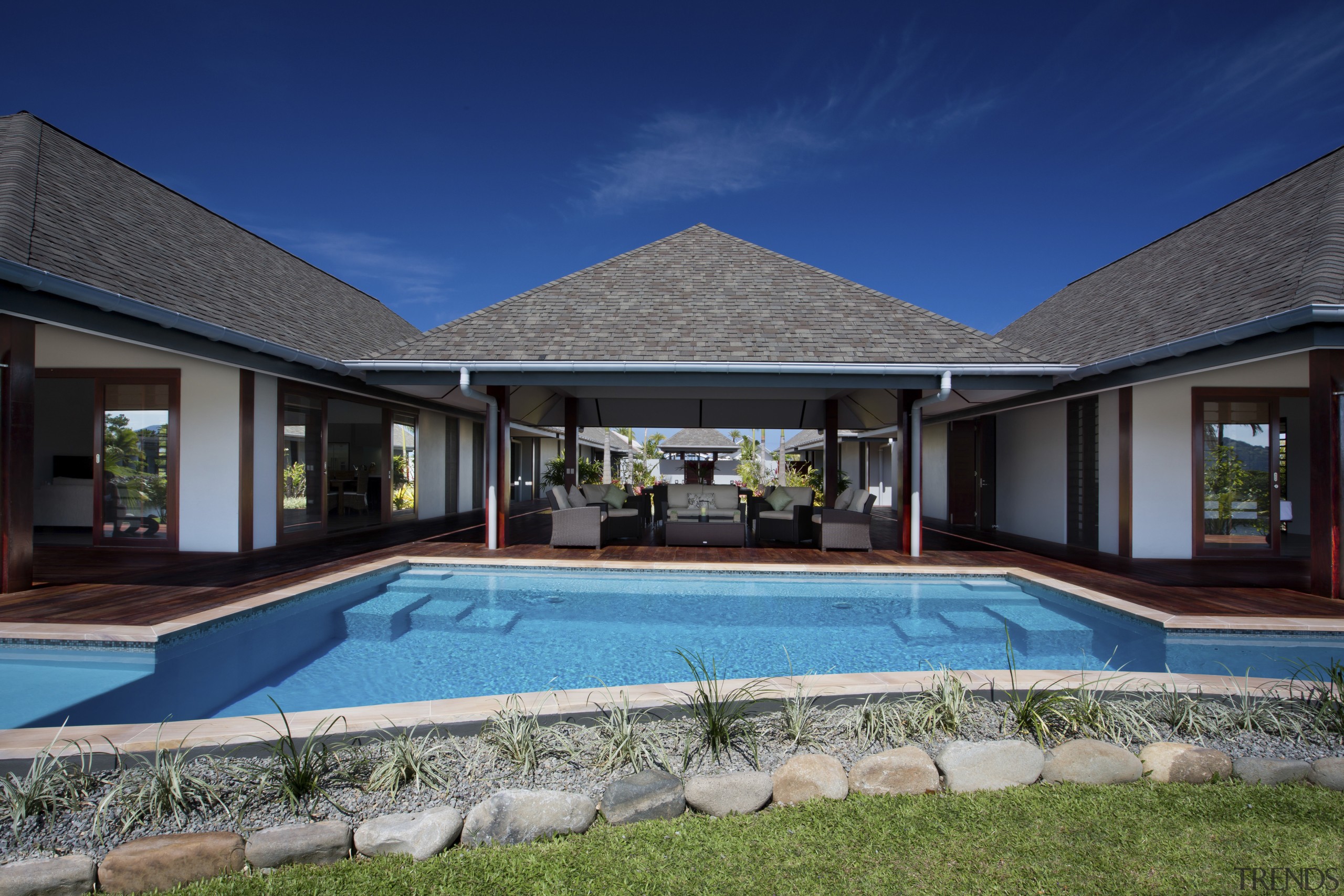 Under tropical skies  Marley Magnum spouting and architecture, backyard, cottage, estate, facade, home, house, leisure, property, real estate, residential area, resort, roof, sky, swimming pool, villa, window, blue