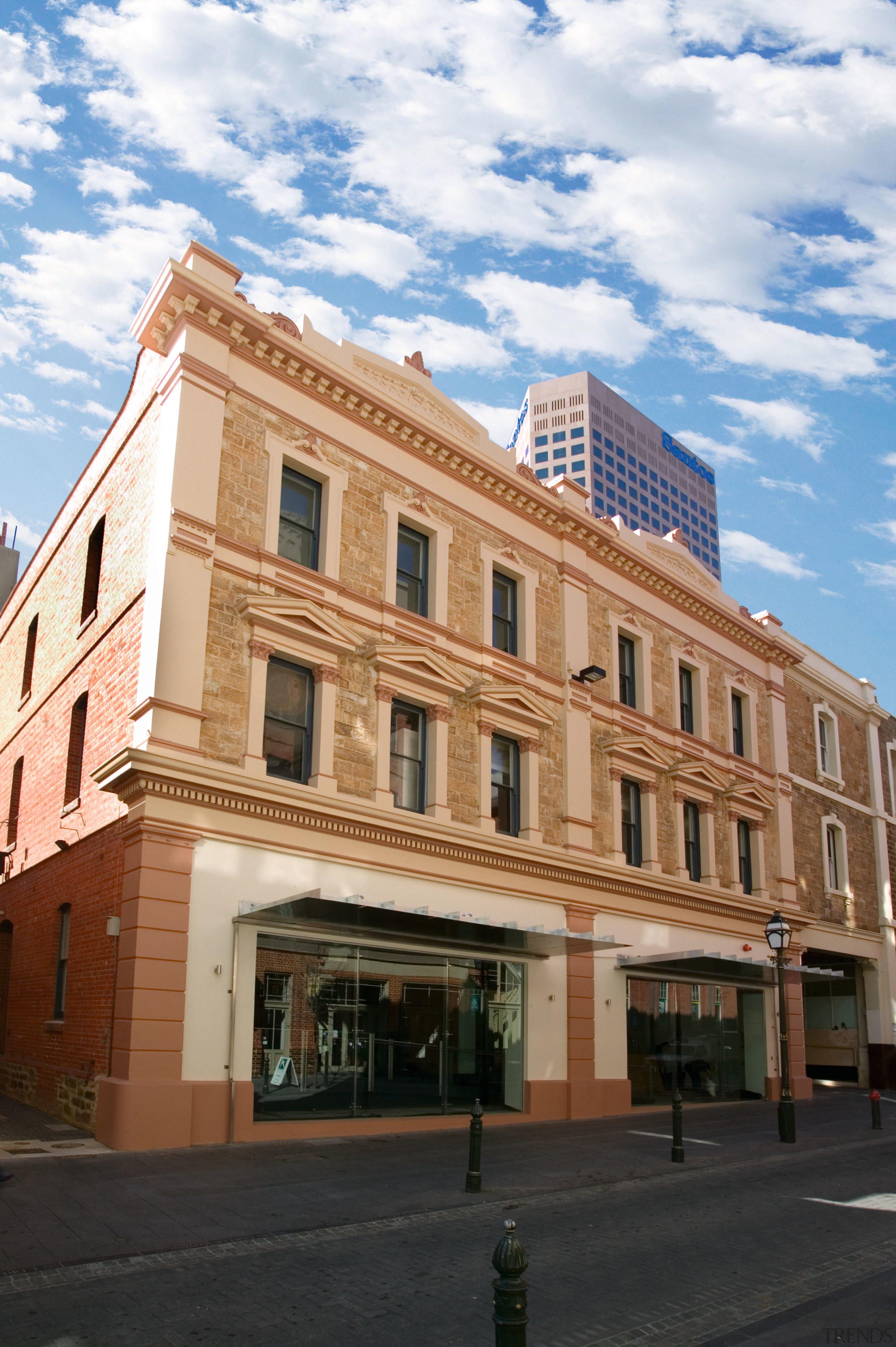 view of this adelaide heritage protected building that apartment, architecture, building, city, commercial building, condominium, daytime, downtown, facade, house, landmark, metropolis, metropolitan area, mixed use, neighbourhood, property, real estate, residential area, sky, town, window, white