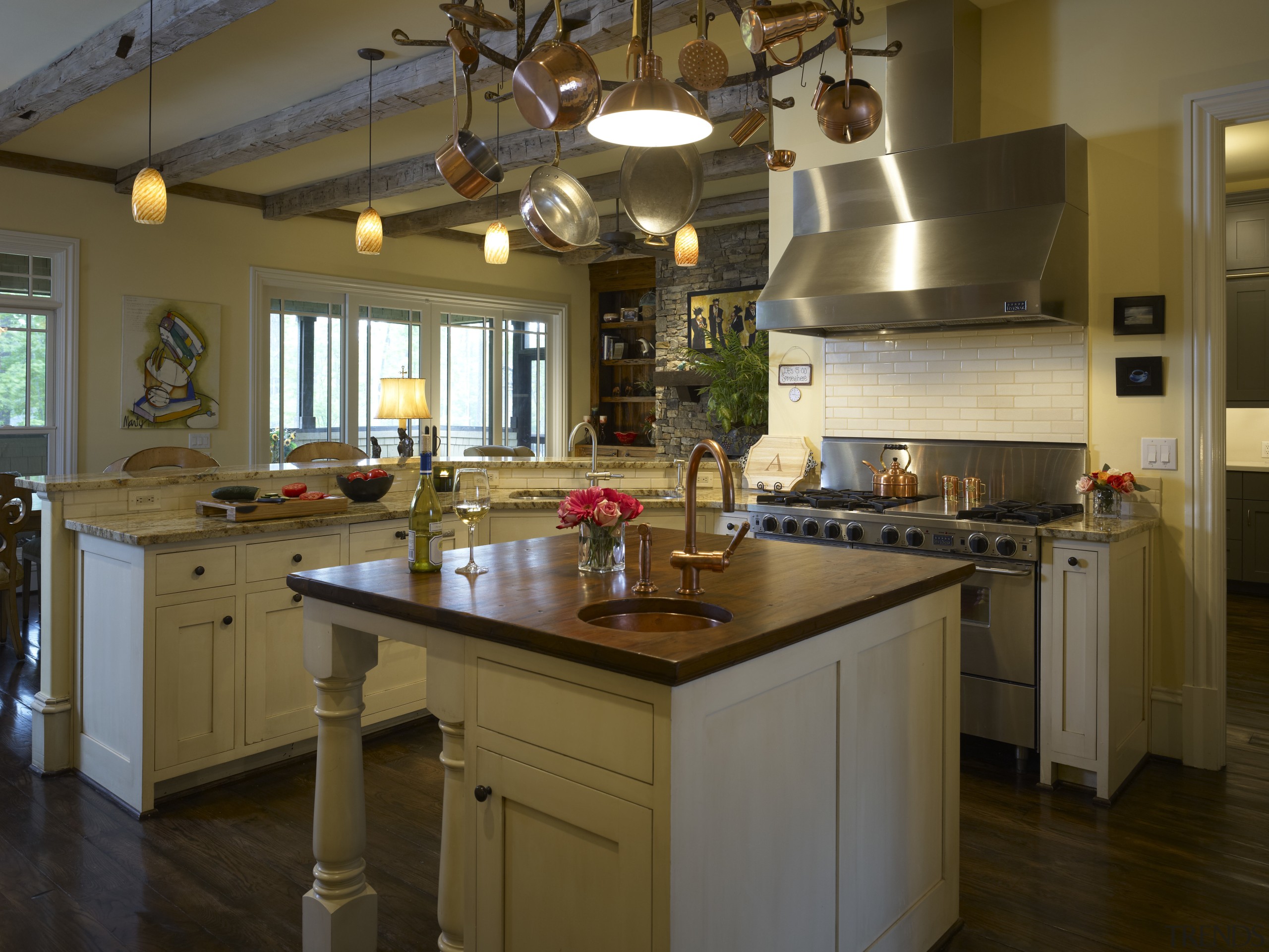 View of an open-plan kitchen featuring a central countertop, cuisine classique, interior design, kitchen, room, brown