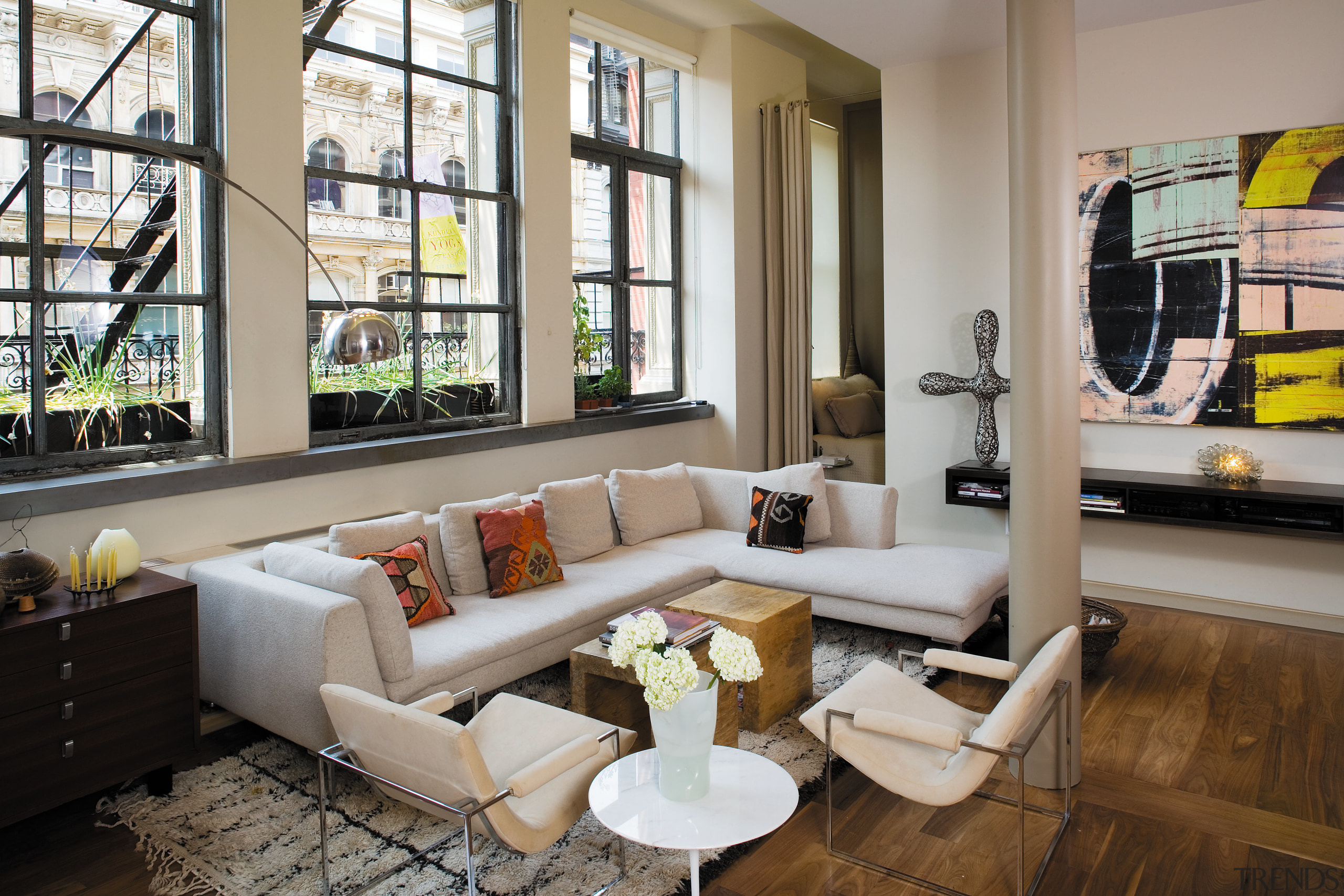 A view of the living area, wooden flooring. apartment, furniture, home, interior design, living room, lobby, loft, real estate, room, gray