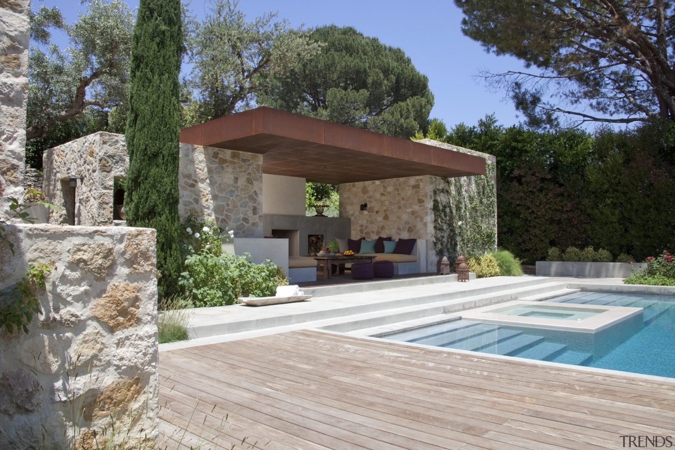 View of the patio area and pool.  backyard, estate, home, house, outdoor structure, property, real estate, villa, gray