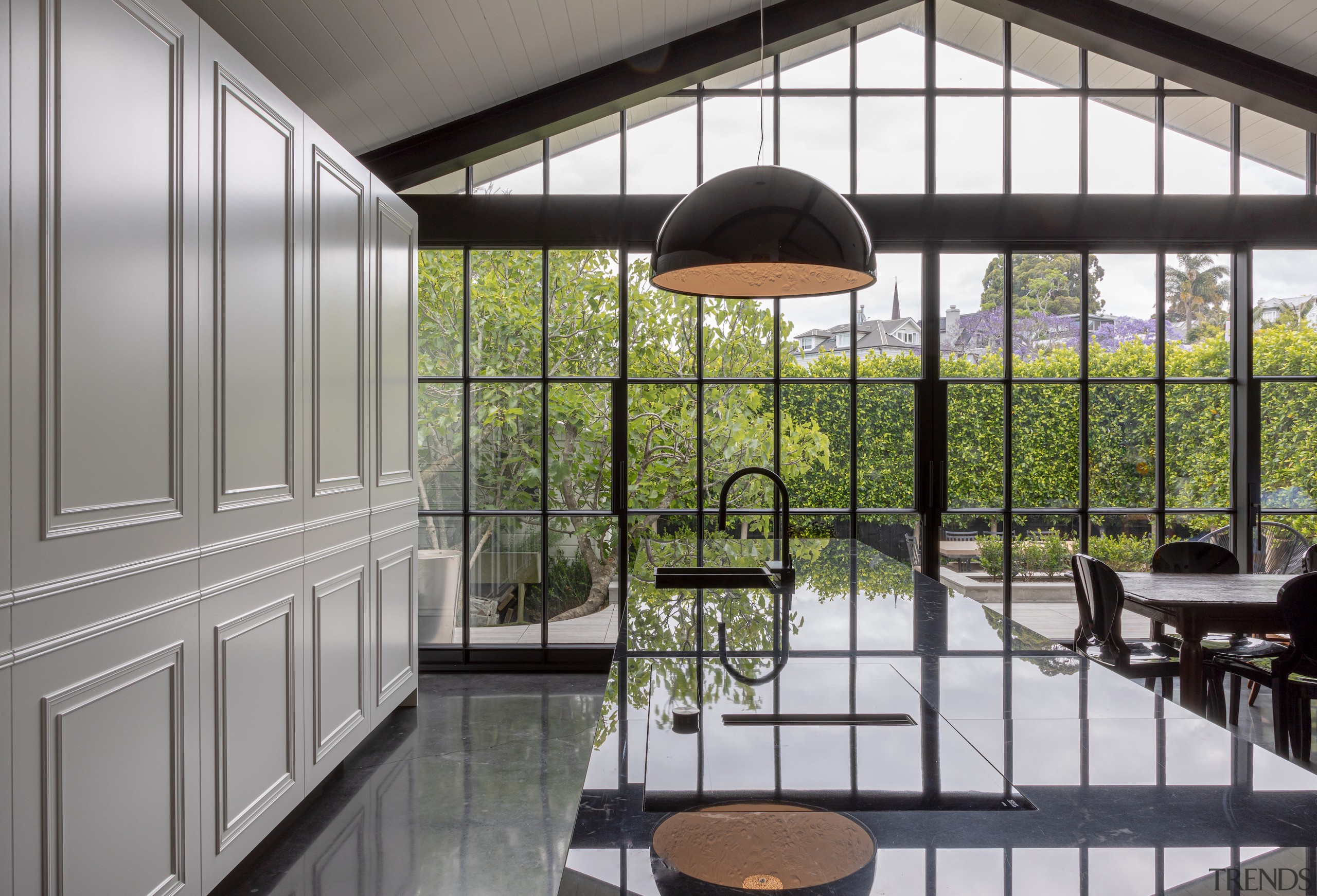 Steel Crittall-style doors expand the room and help 