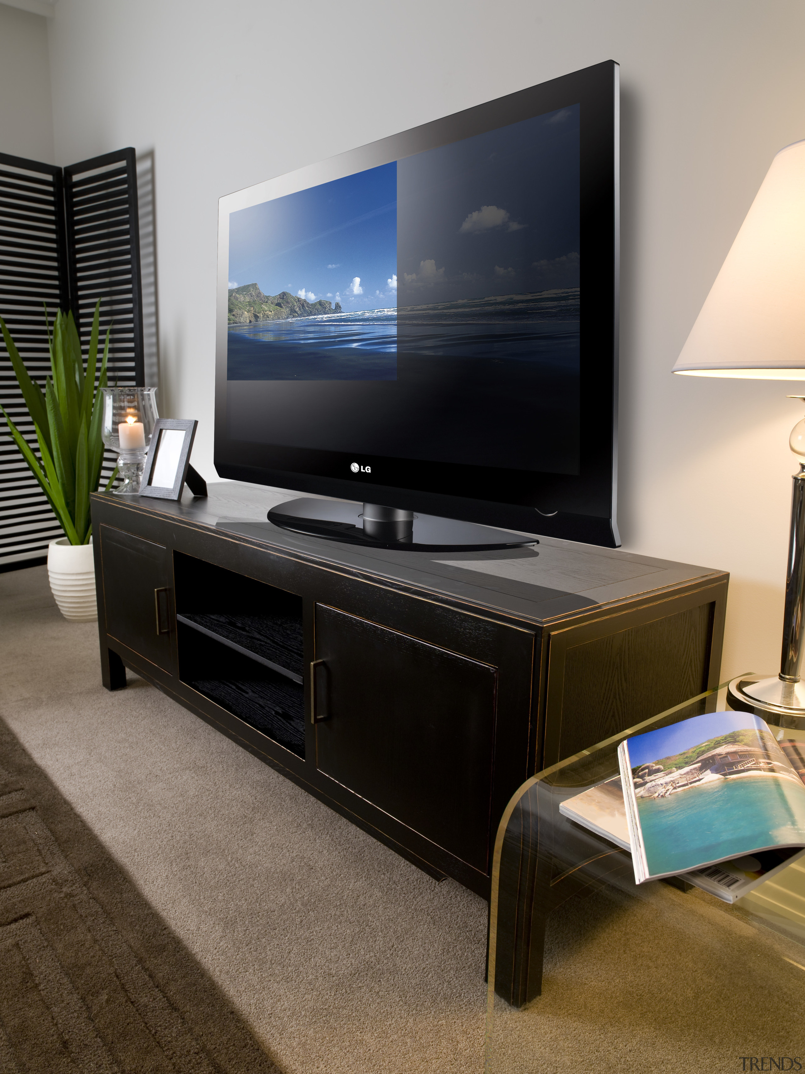 View of plasma screen tv sitting on a display device, electronics, flat panel display, furniture, interior design, multimedia, television, gray, black, brown