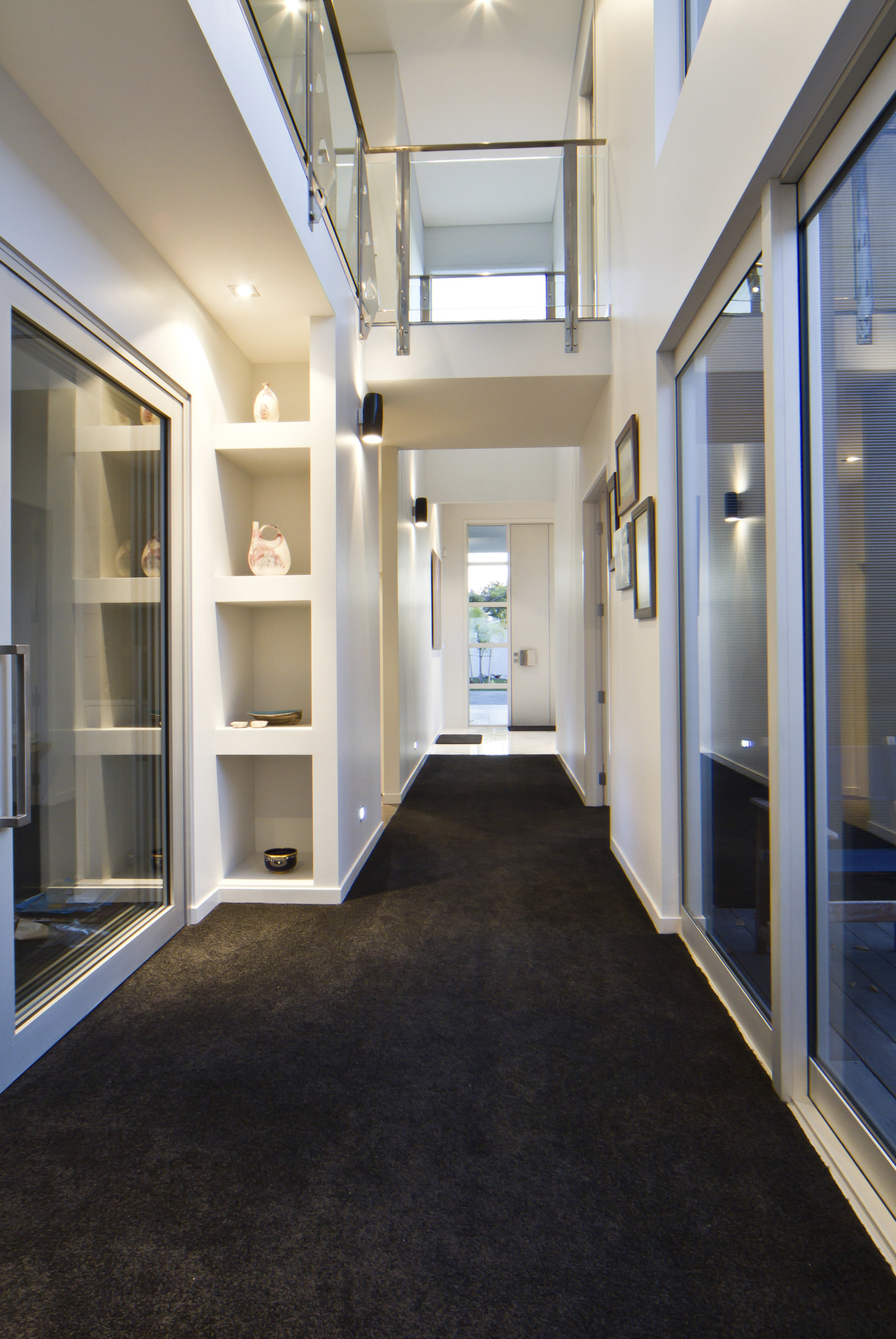 This house was designed and built by Signature architecture, ceiling, daylighting, floor, flooring, hall, house, interior design, lobby, real estate, window, gray, black