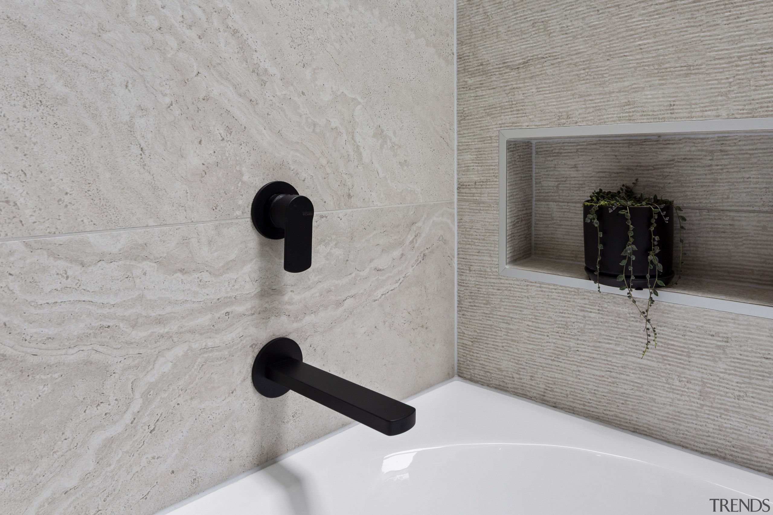 Black tapware complements feature tile work. 