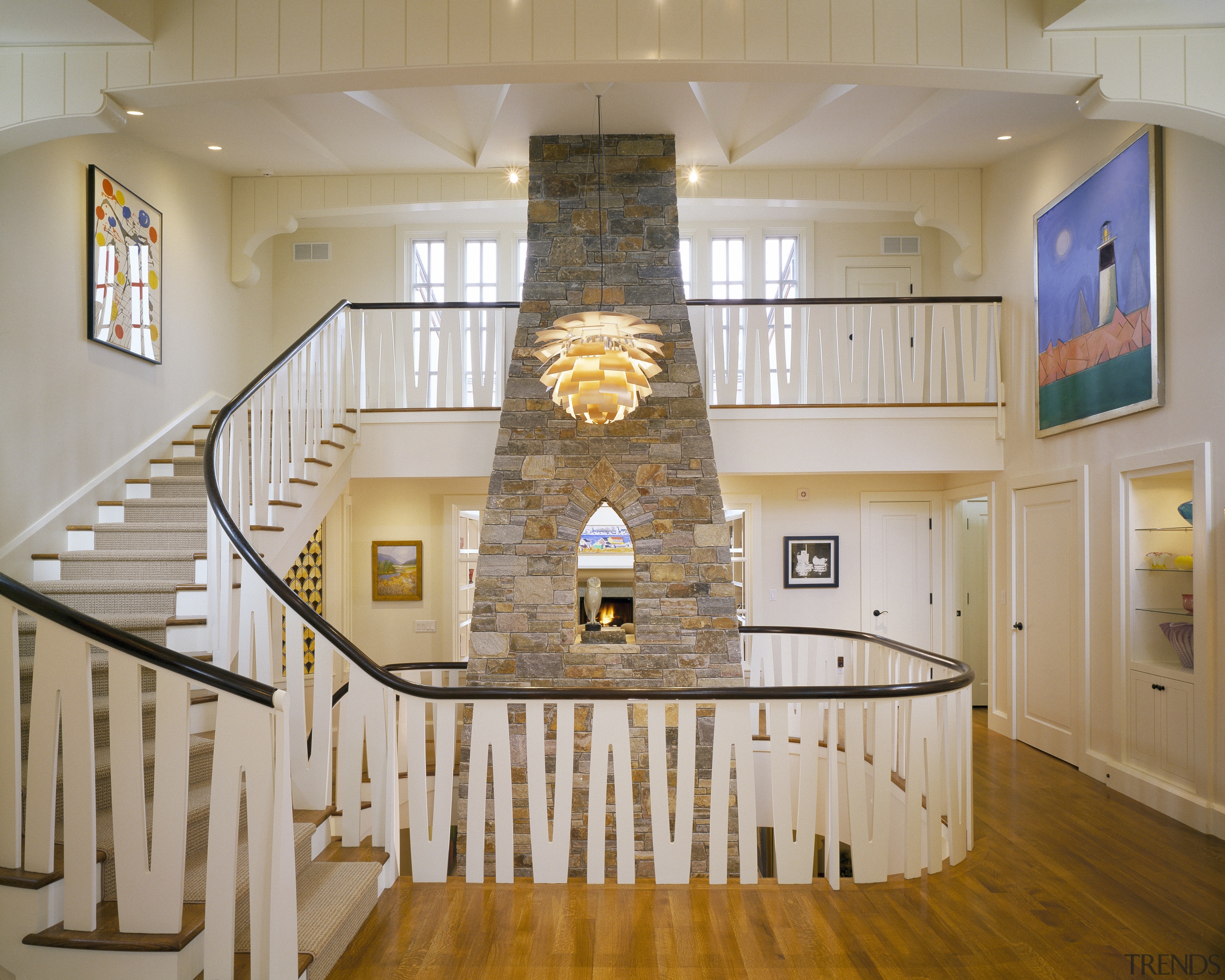 View of stairway wrapping around stone fireplace. - baluster, ceiling, daylighting, estate, floor, flooring, handrail, hardwood, home, interior design, lobby, real estate, room, stairs, wall, wood, wood flooring, gray, brown