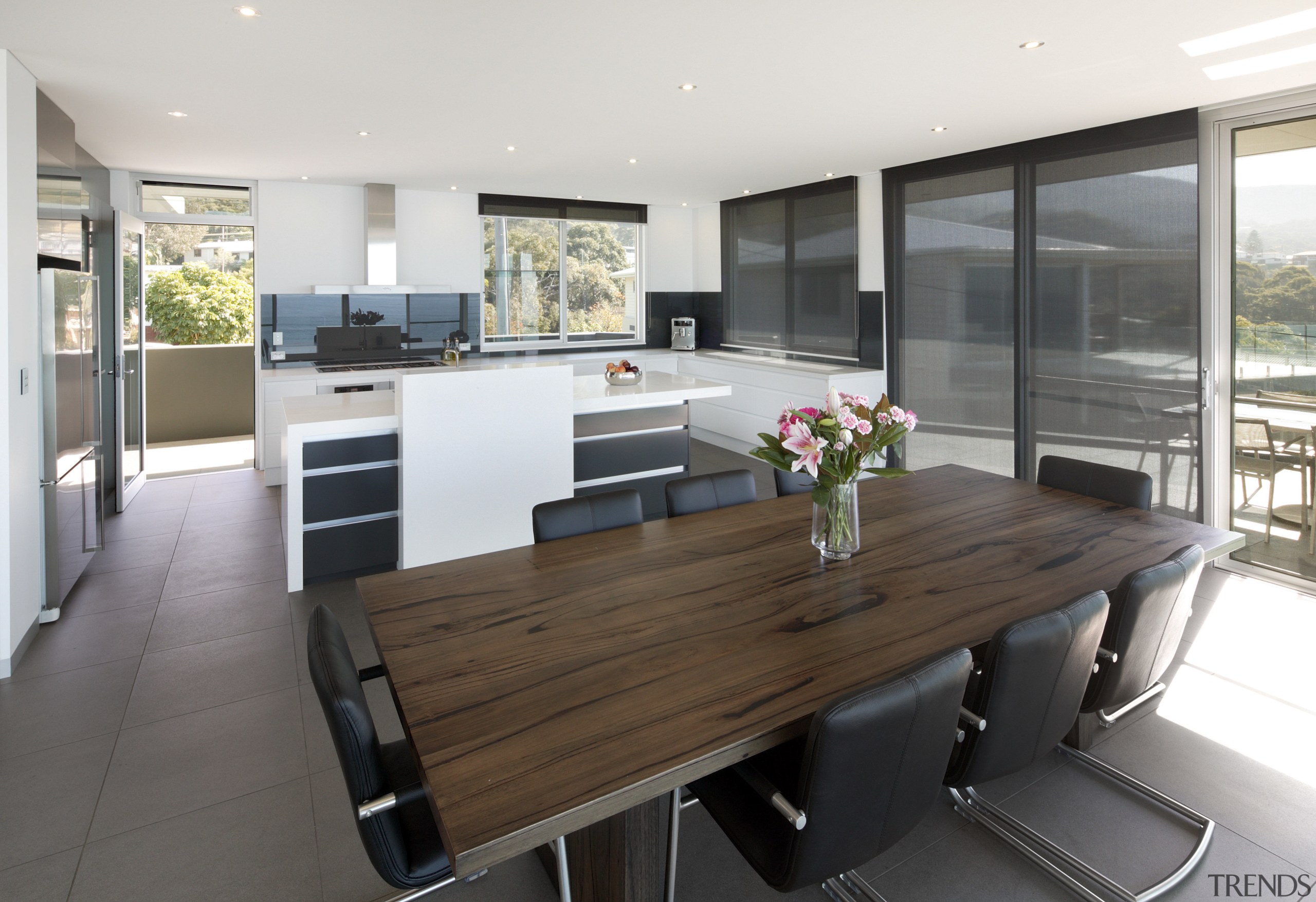 View of kitchen and dining area  designed countertop, interior design, kitchen, property, real estate, white, gray