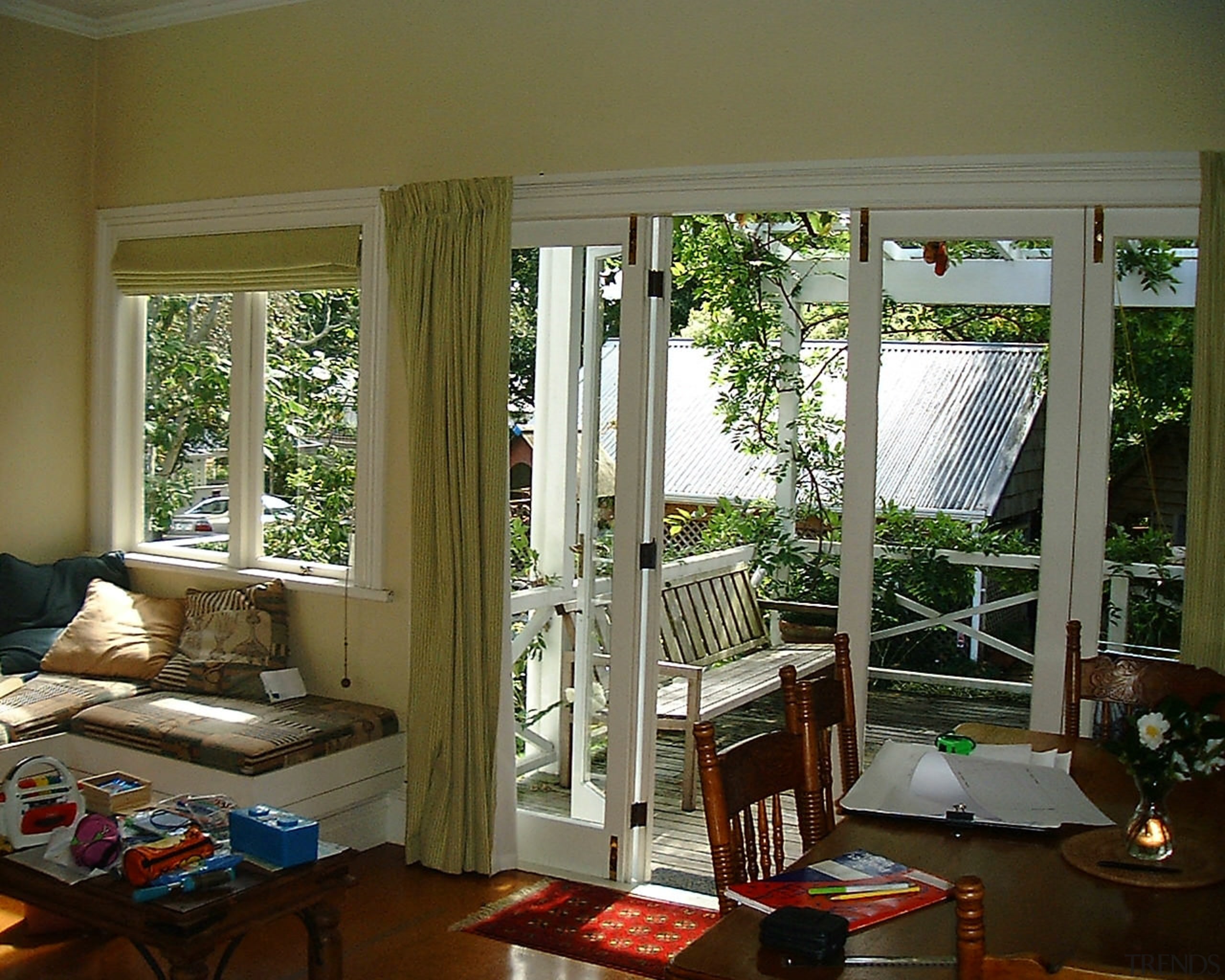 Family living in New Zealand traditional villa before curtain, door, home, house, interior design, living room, real estate, room, textile, window, window covering, window treatment, wood, brown