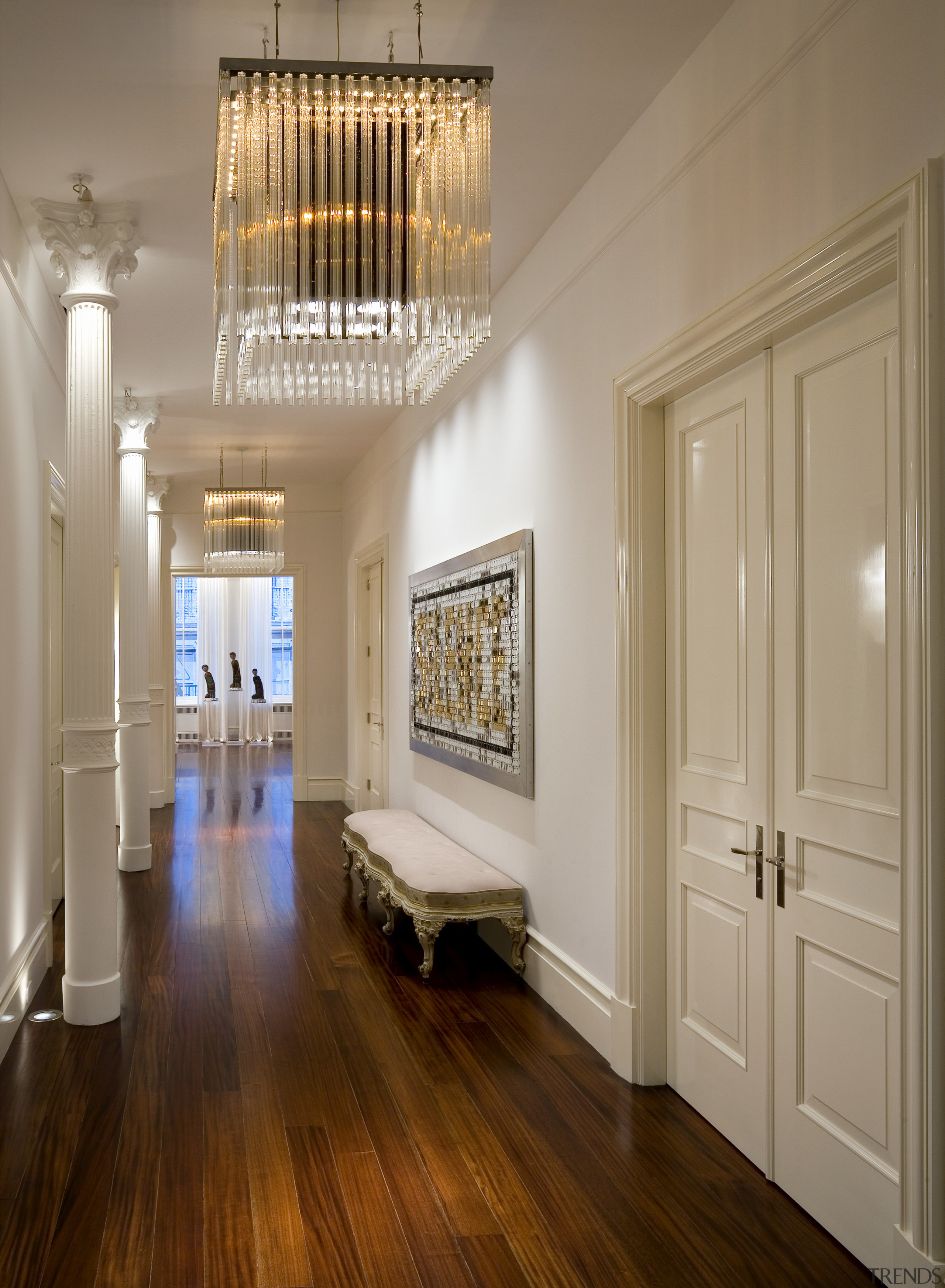 View of the entrance way featuring mahogany floors, ceiling, floor, flooring, hall, hardwood, home, interior design, molding, room, wall, window, wood, wood flooring, brown, gray