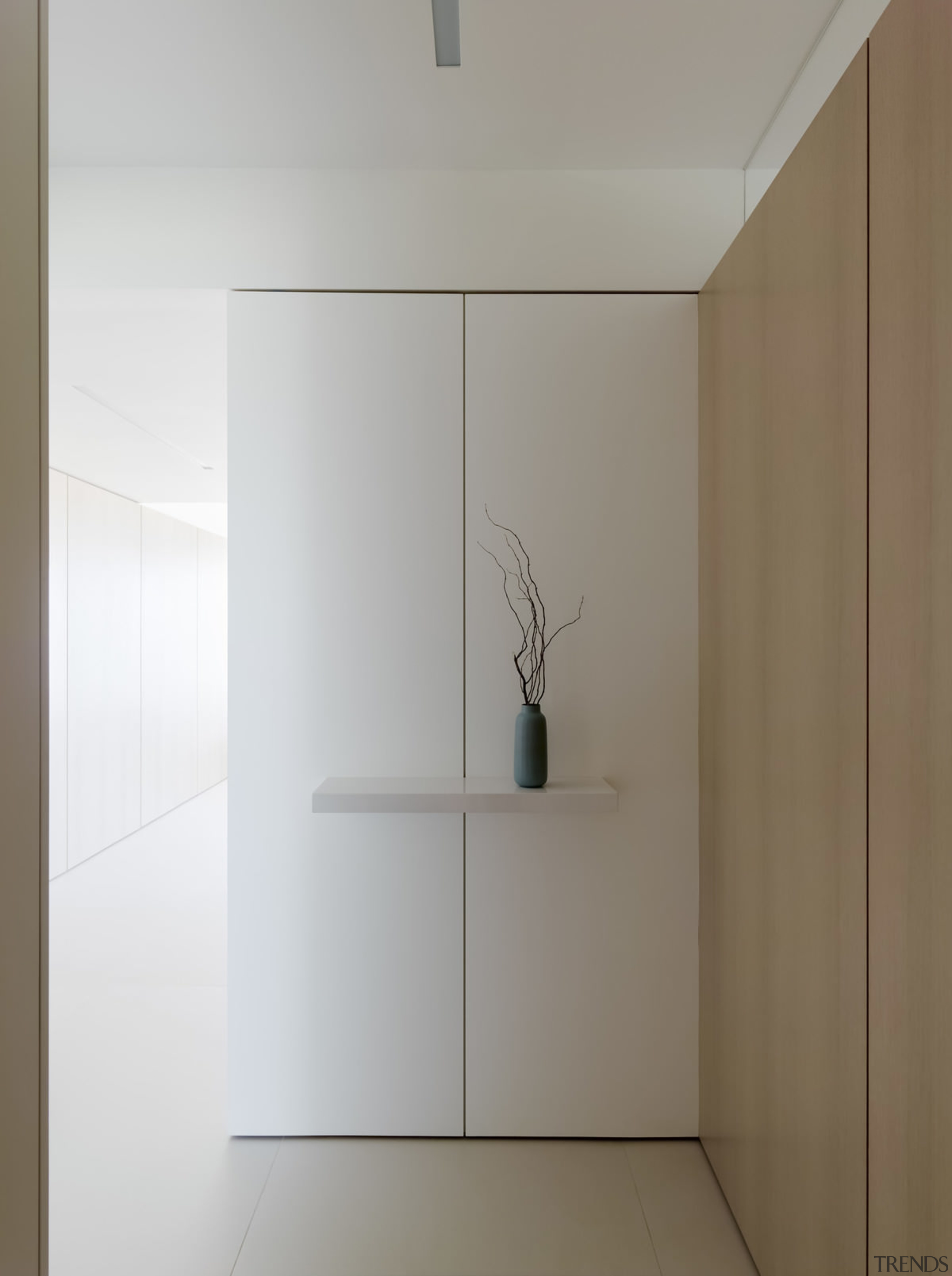 With white walls and simple wood panels, the architecture, interior design, product design, gray, white, brown