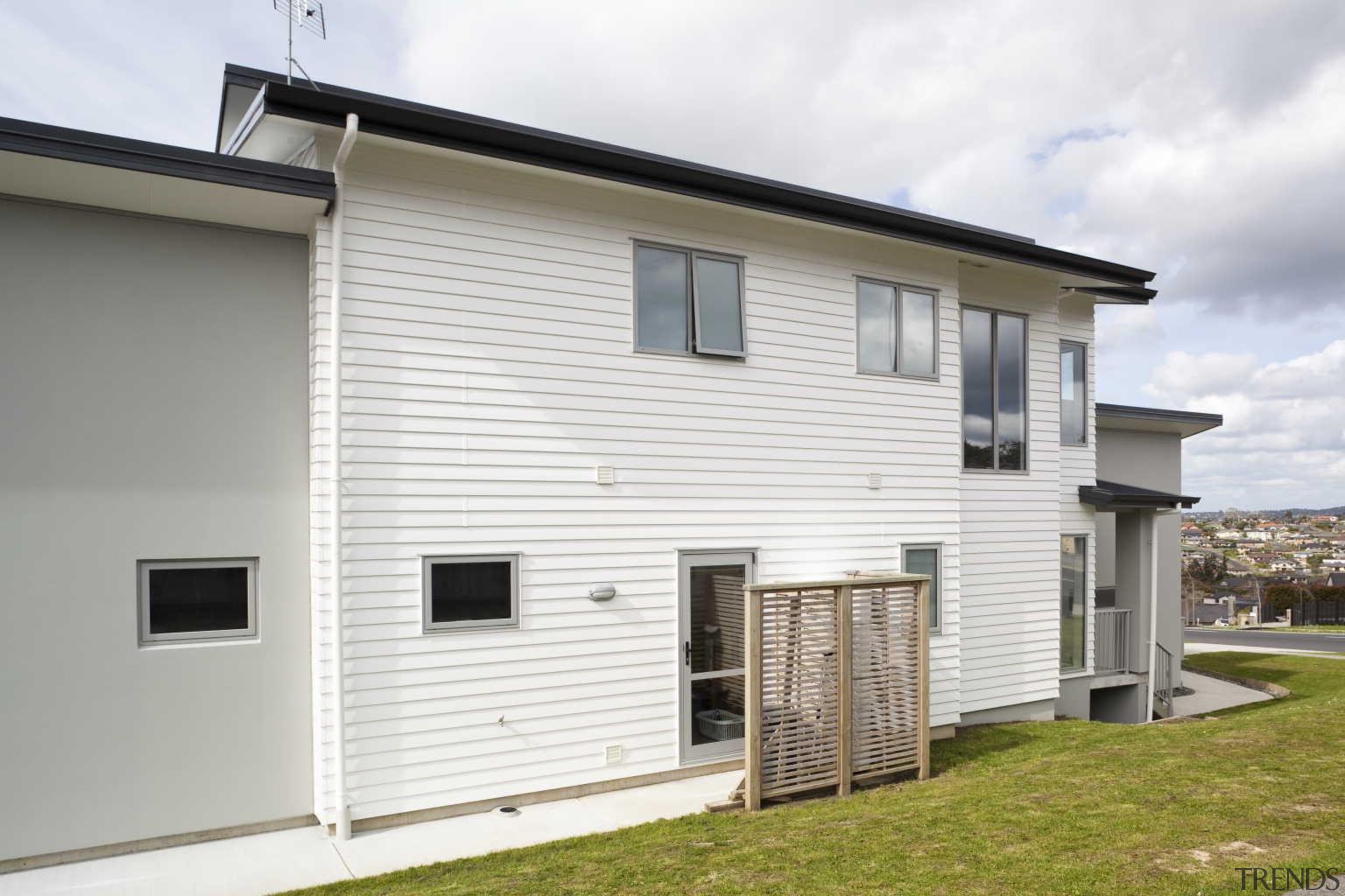 White wall covering the house - Exterior - building, elevation, facade, home, house, property, real estate, residential area, siding, wall, window, white