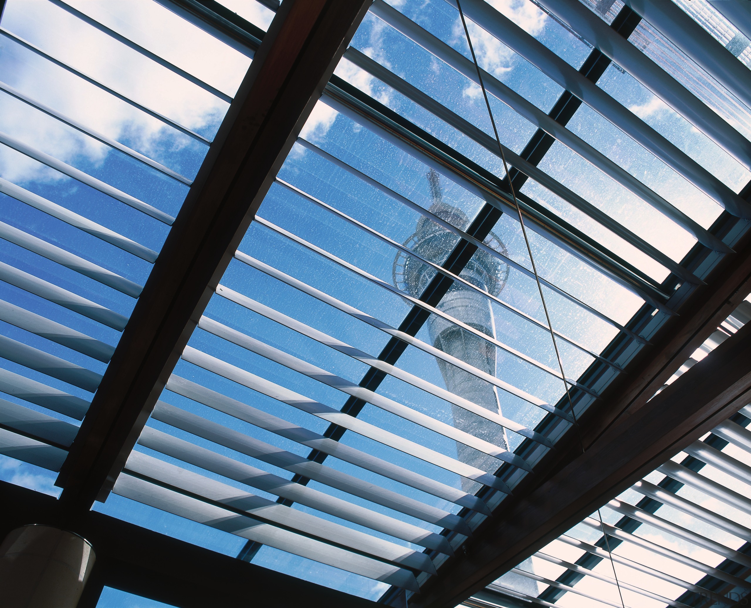 View of aluminium window louvres with Sky Tower angle, architecture, building, daylighting, daytime, facade, glass, light, line, metal, metropolitan area, roof, sky, steel, structure, symmetry, window, teal, black