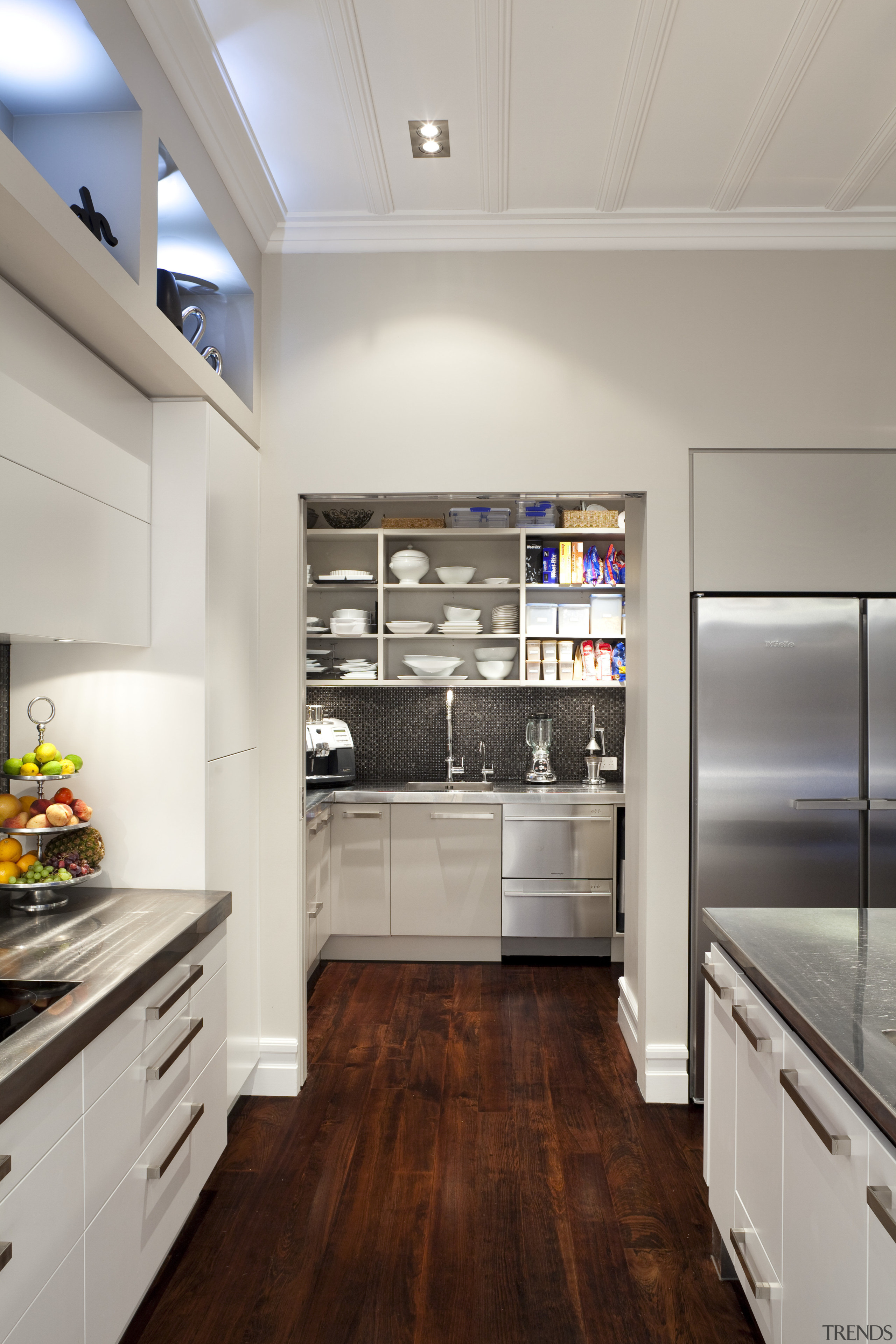 scullery through open archway at rear of kitchen cabinetry, countertop, cuisine classique, floor, flooring, hardwood, home appliance, interior design, kitchen, room, wood flooring, gray