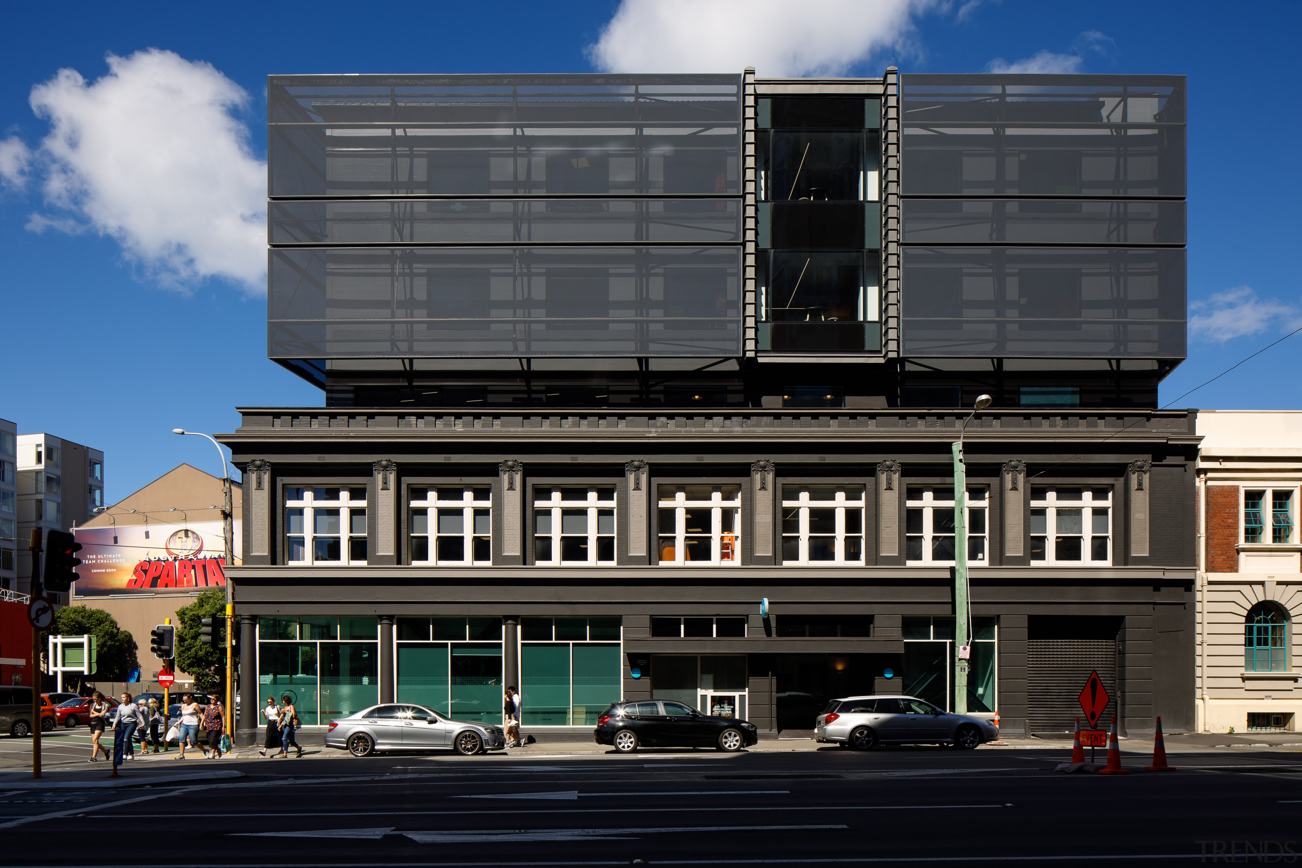 By day, the new facade on the upper architecture, building, city, commercial building, downtown, facade, house, human settlement, metropolitan area, mixed-use, neighbourhood, real estate, residential area, sky, street, town, urban area, black