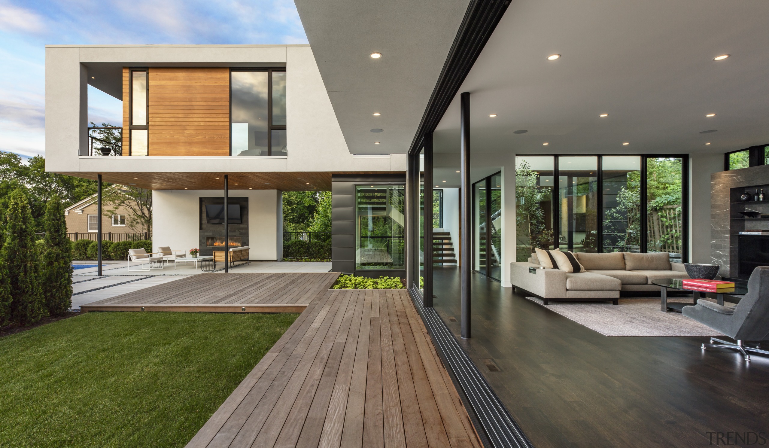 ​​​​​​​A series of glass sliding panels allows the architecture, deck, home, house, interior design, living room, patio, window, sliding windows, Peterssen Keller Architects