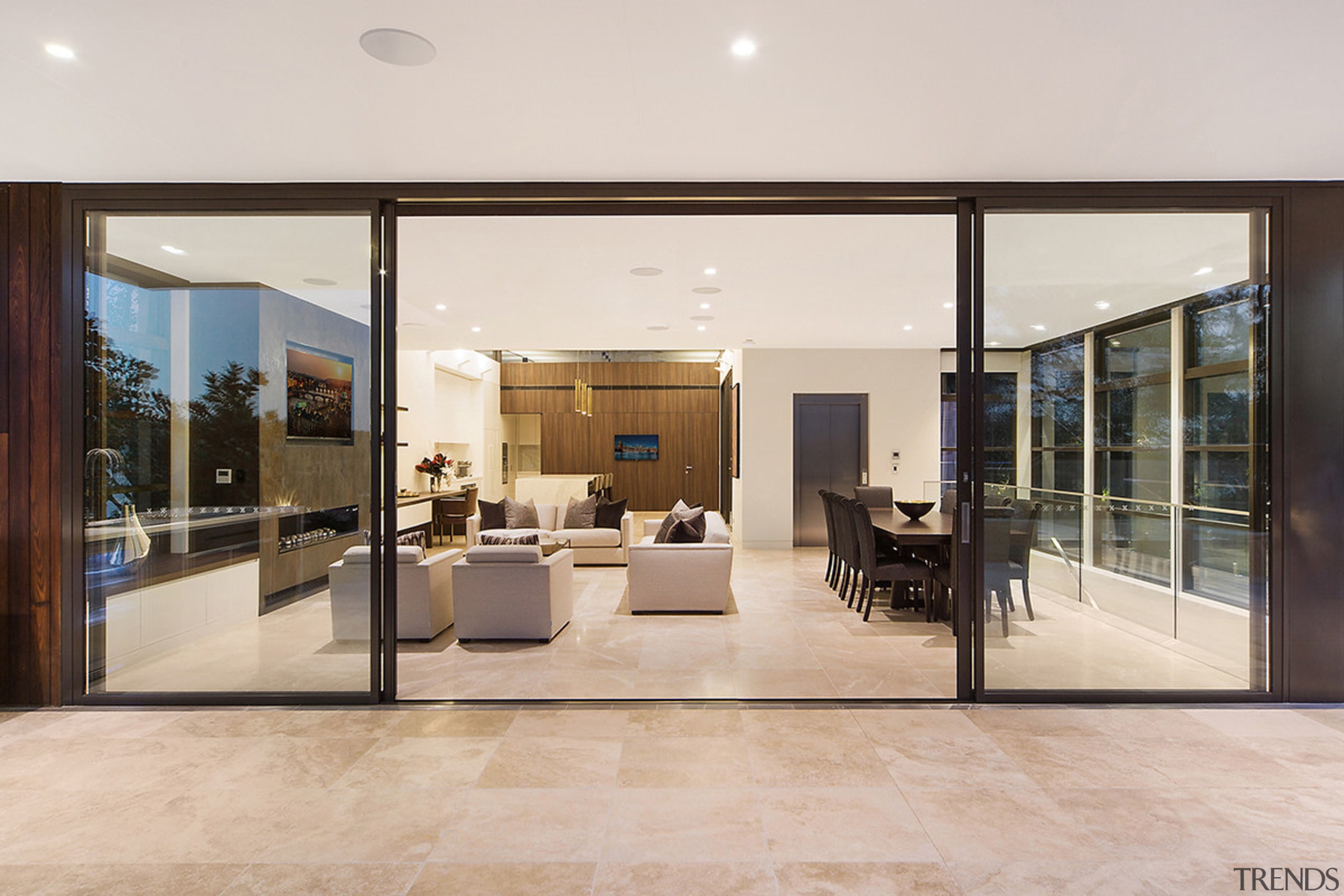 On this top floor of a three-level Sydney door, floor, flooring, house, interior design, lobby, real estate, window, gray