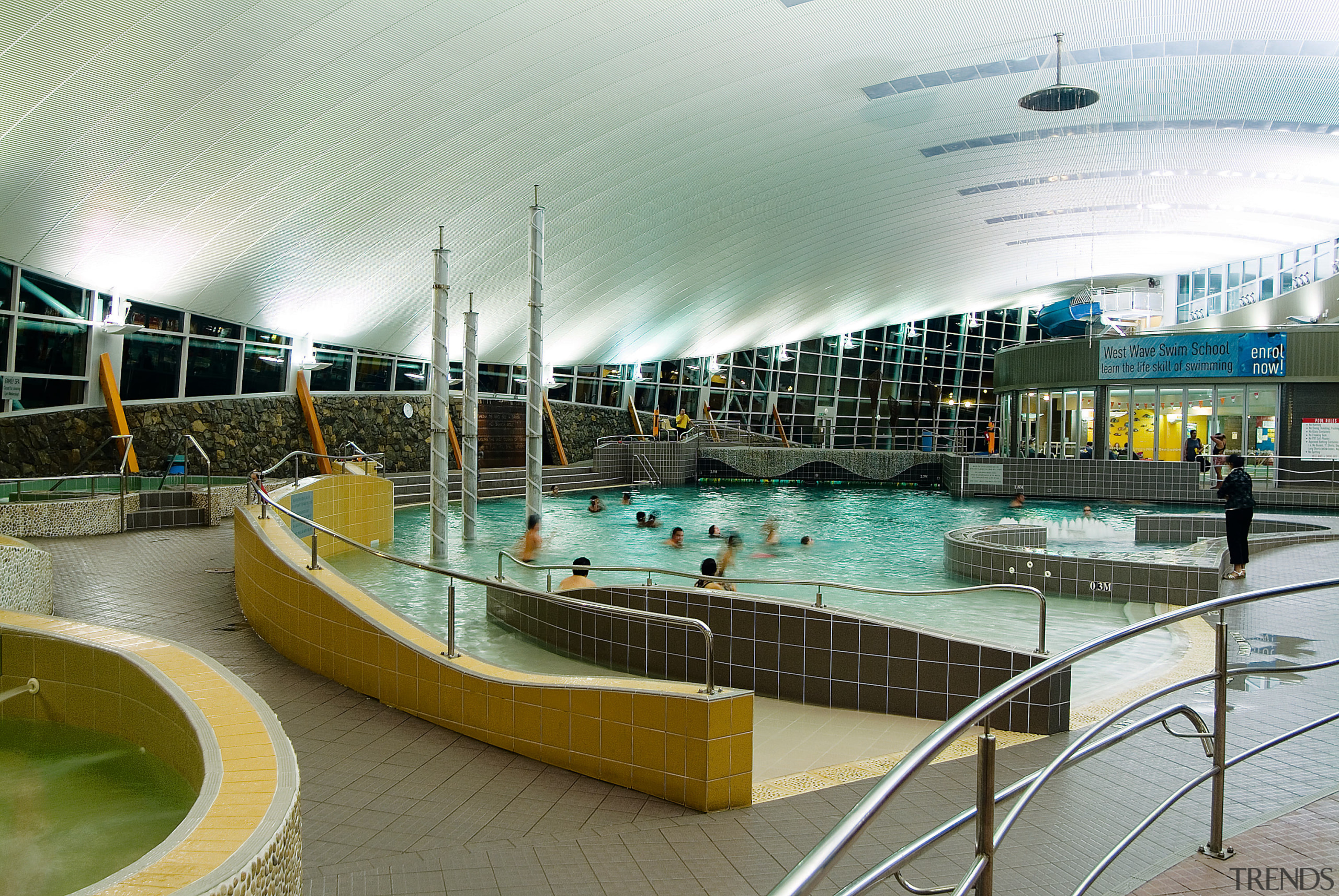 Indoor pool complex with curved roofing, and several leisure, leisure centre, recreation, reflection, swimming pool, water, gray