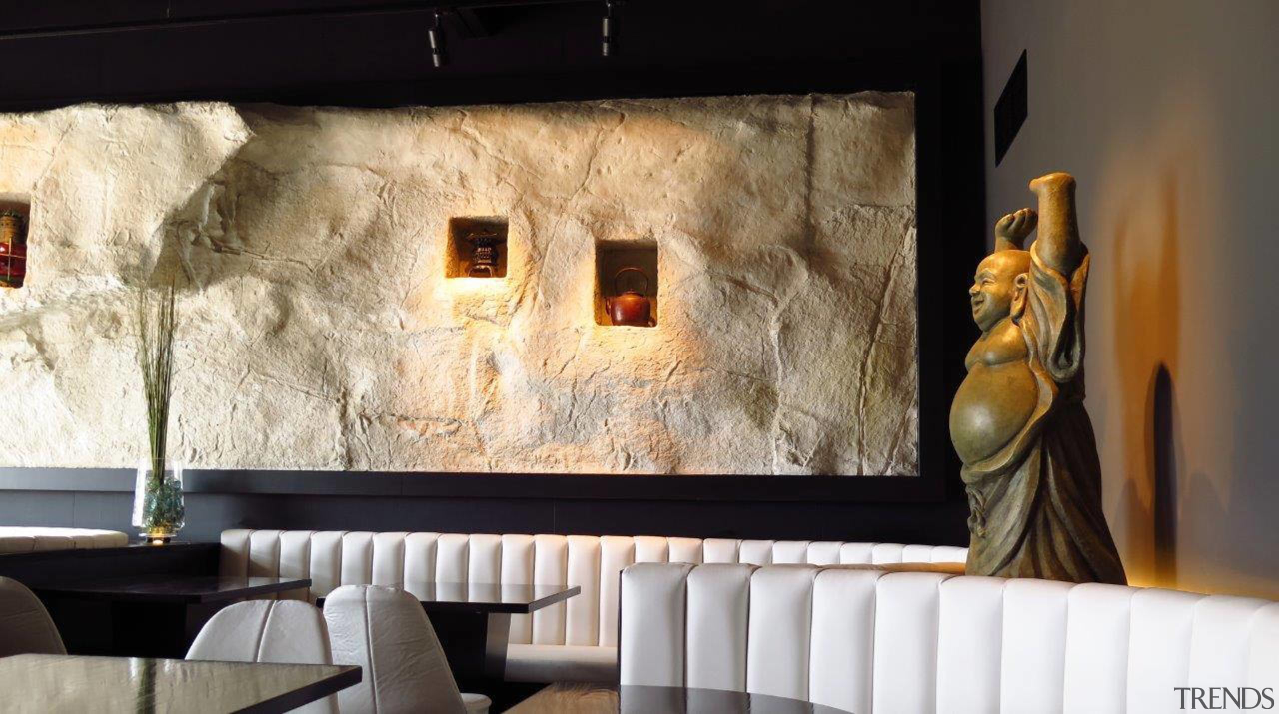 At Tokyo Bay restaurant a faux stone wall interior design, room, wall, black, white
