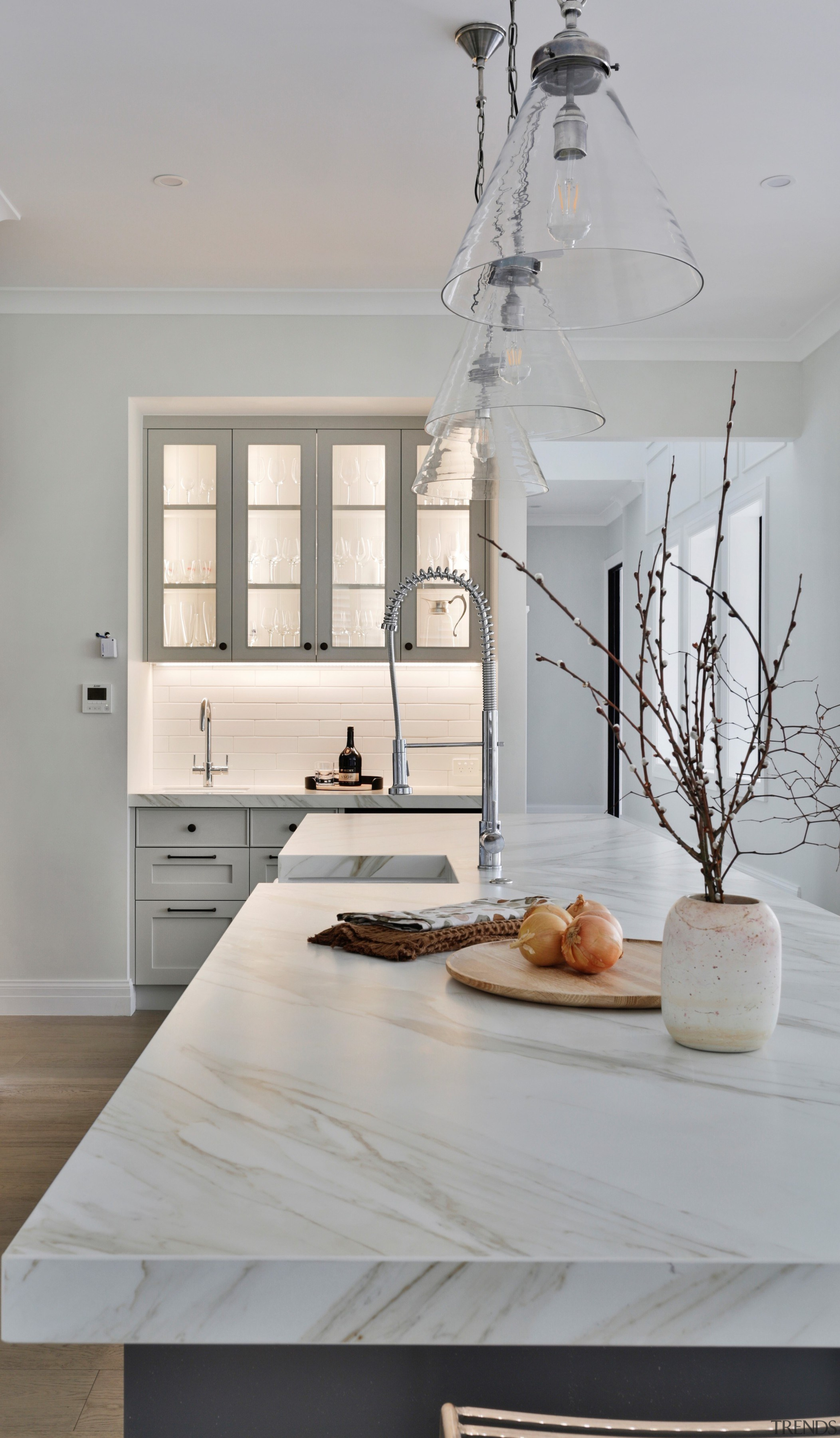 The kitchen island with bar area seen behind. 