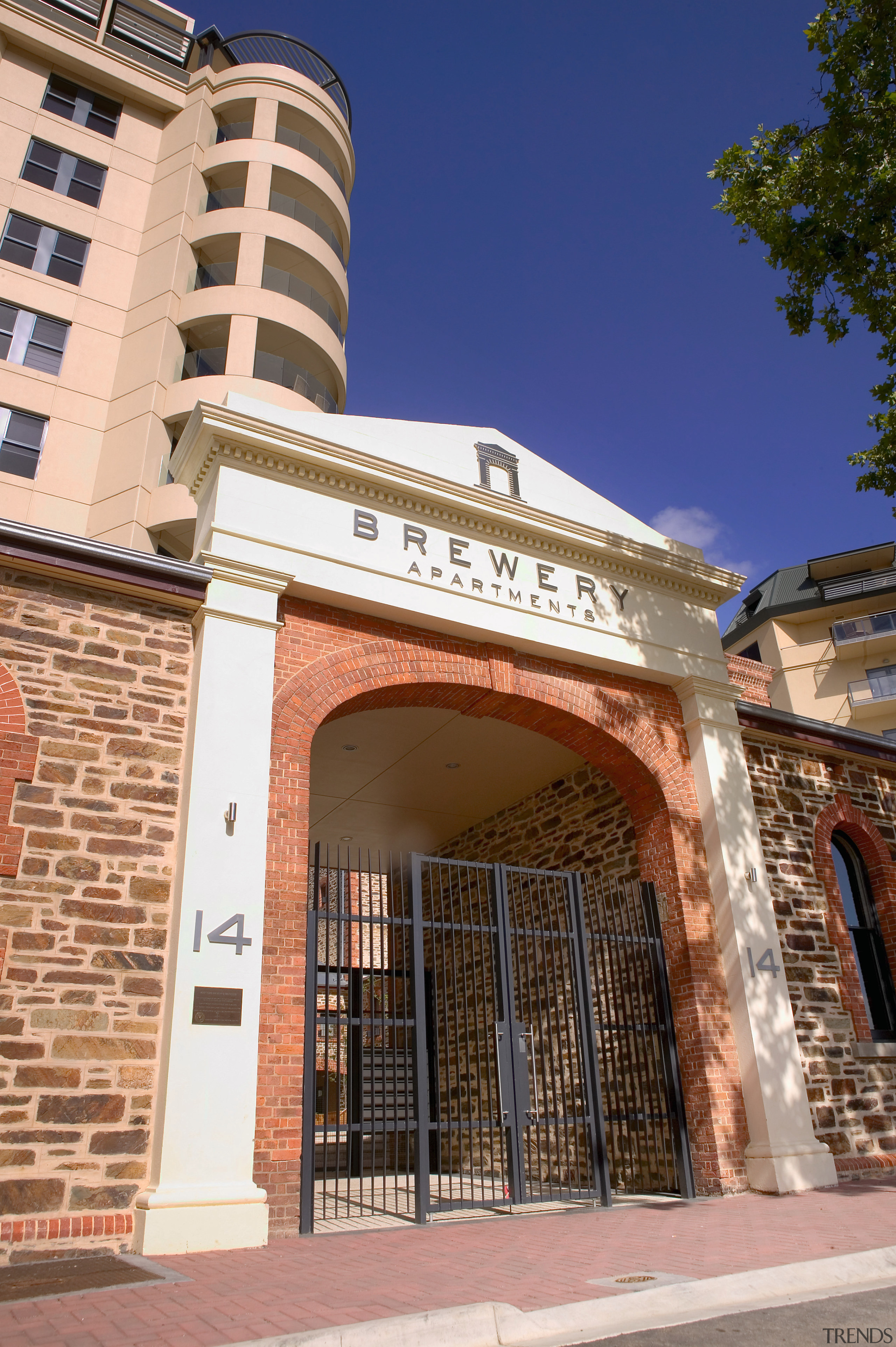 Entranceway to Brewery Apartments complex with original bluestone architecture, brick, building, city, facade, landmark, neighbourhood, real estate, window, brown