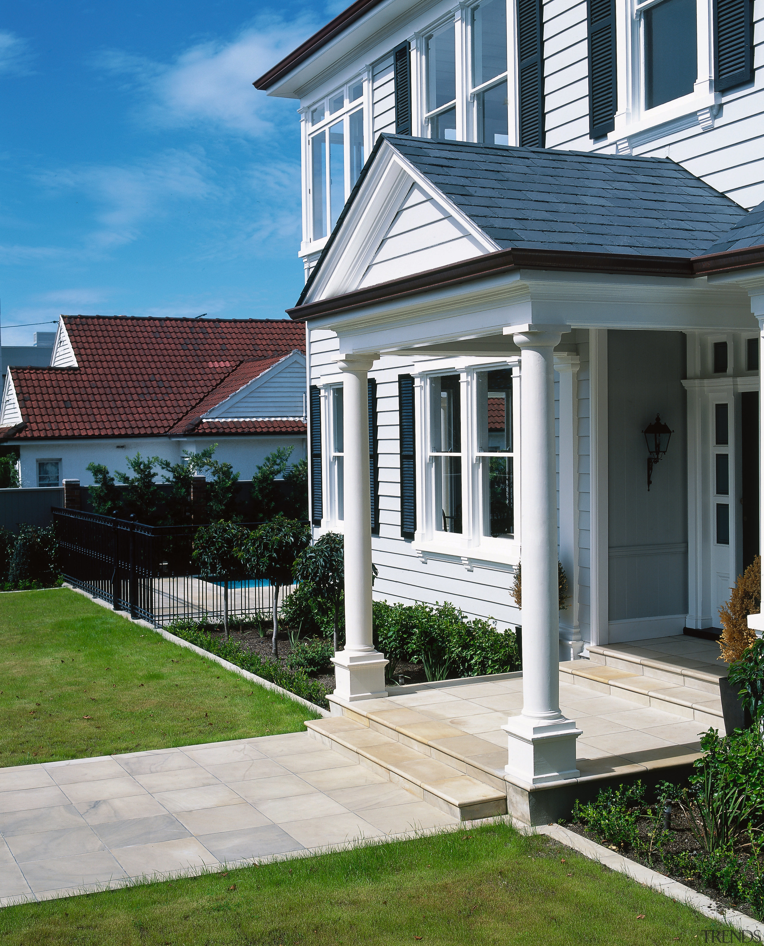 view of the entrance and pathway using tuscanmoire cottage, estate, facade, home, house, outdoor structure, porch, property, real estate, residential area, siding, structure, walkway, window