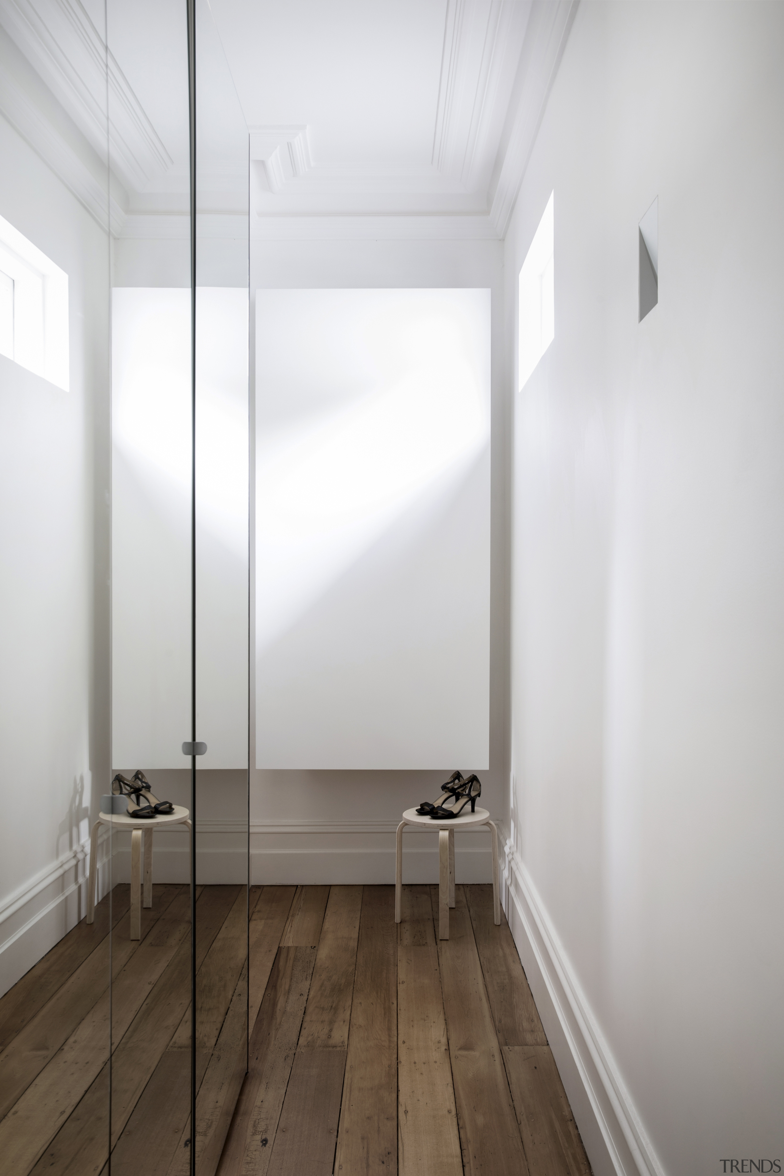 ​​​​​​​The shoes standing sentry on stools are the architecture, ceiling, daylighting, floor, flooring, house, interior design, wood, white