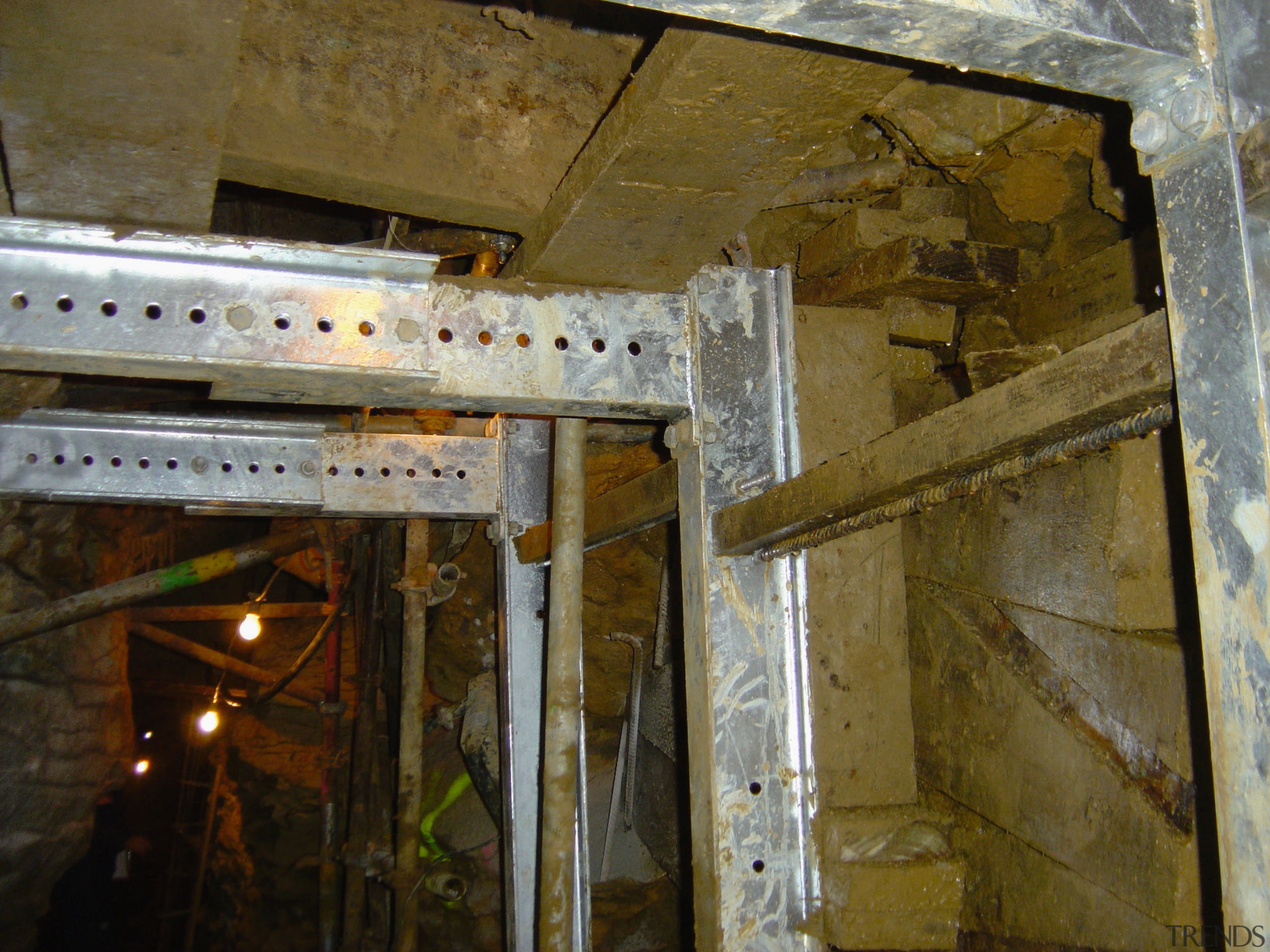 A view of some engineering work within a beam, ceiling, brown