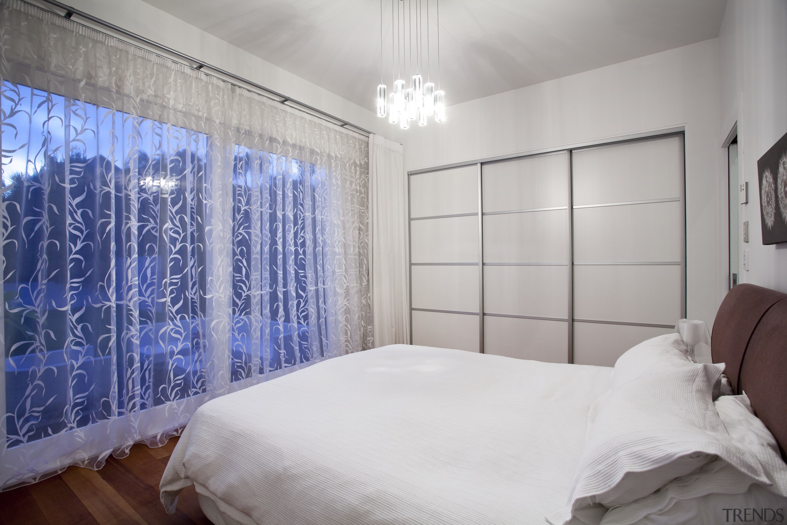 View of contemporary home with wooden flooring, glass bed, bed frame, bed sheet, bedroom, ceiling, home, interior design, property, real estate, room, textile, wall, window, gray