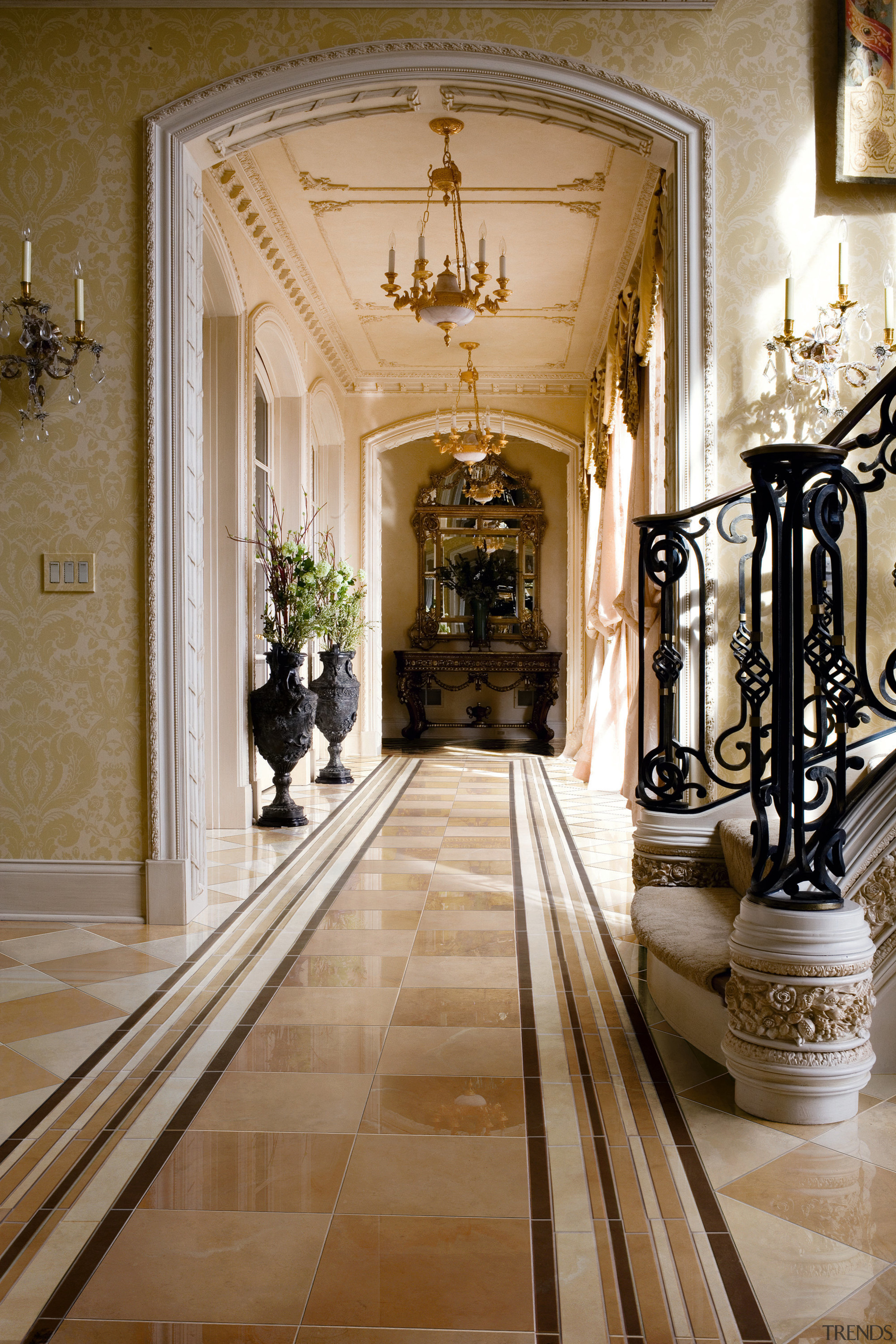 A view of the kitchen an liing areas aisle, arcade, arch, architecture, ceiling, column, estate, floor, flooring, hall, home, interior design, lobby, stairs, brown, gray