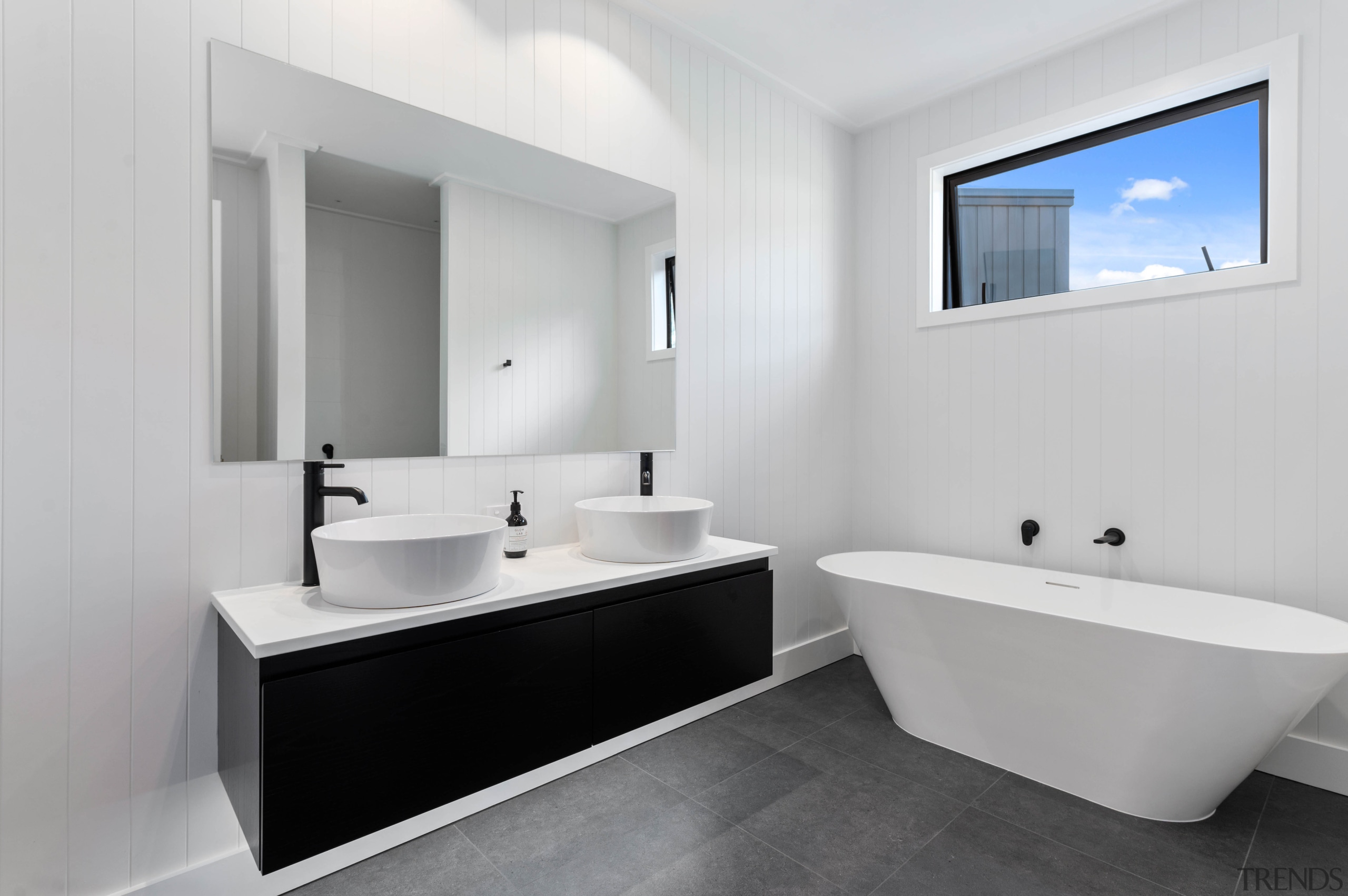 The family bathroom with freestanding tub. - Warm 