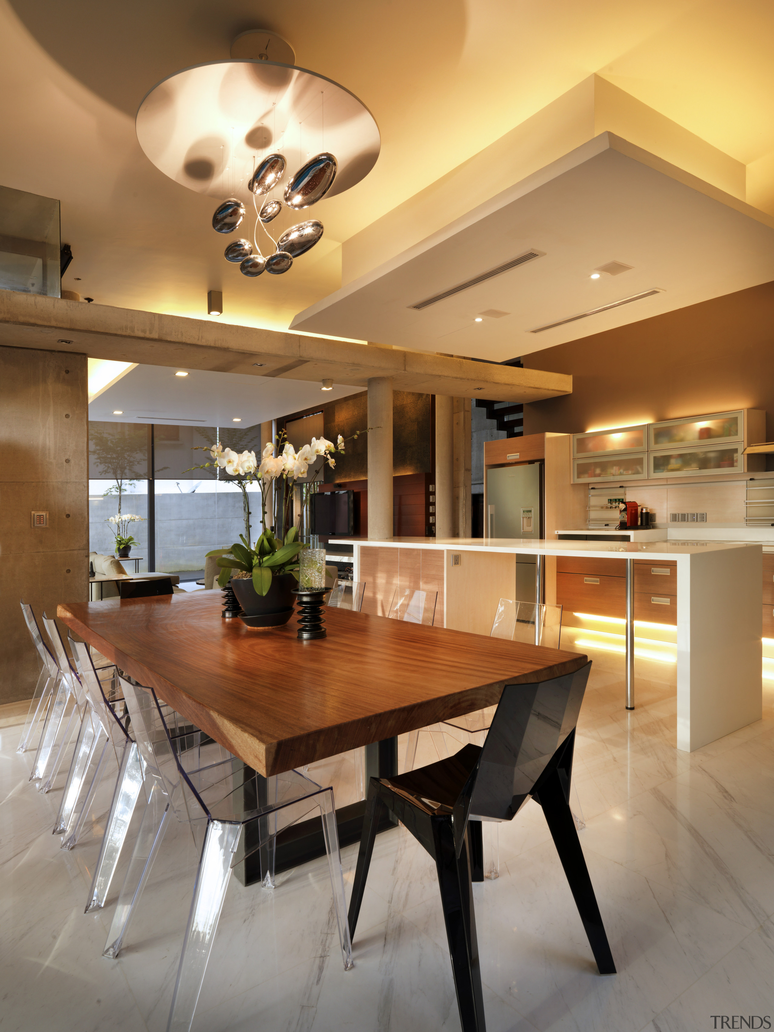 This home was designed with environmental principals in architecture, ceiling, countertop, dining room, furniture, house, interior design, kitchen, room, table, orange, brown