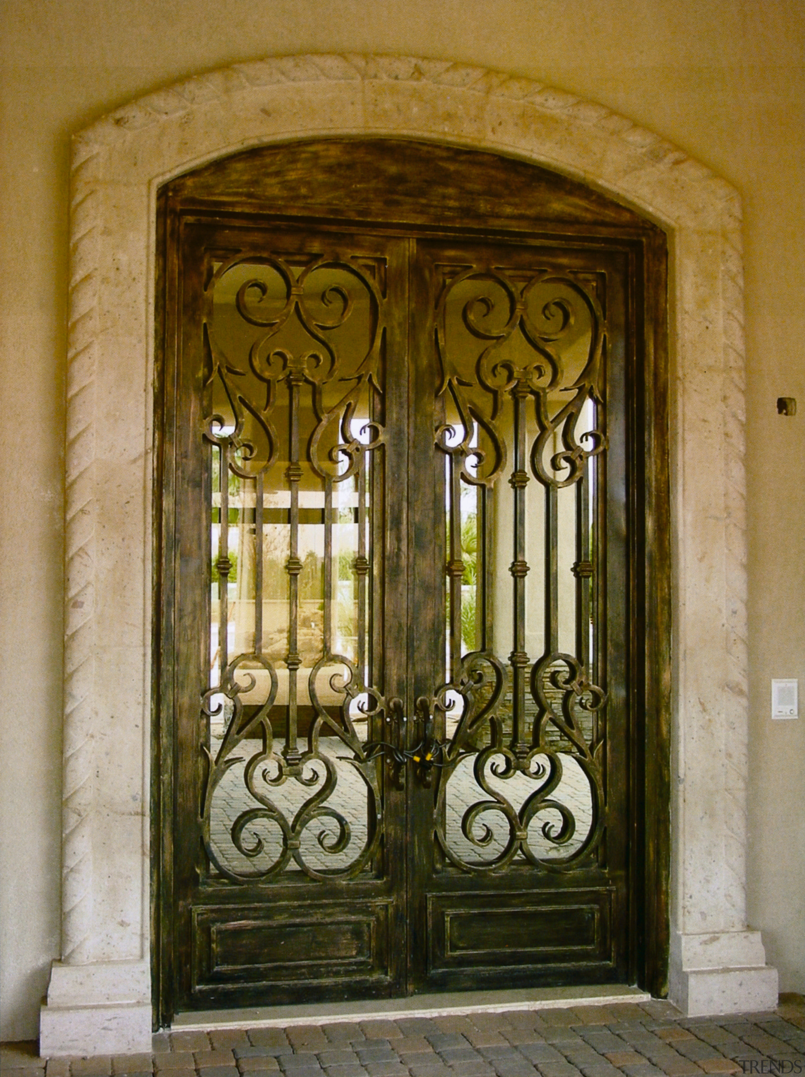 View of an old looking metal gate as arch, door, gate, iron, metal, window, brown