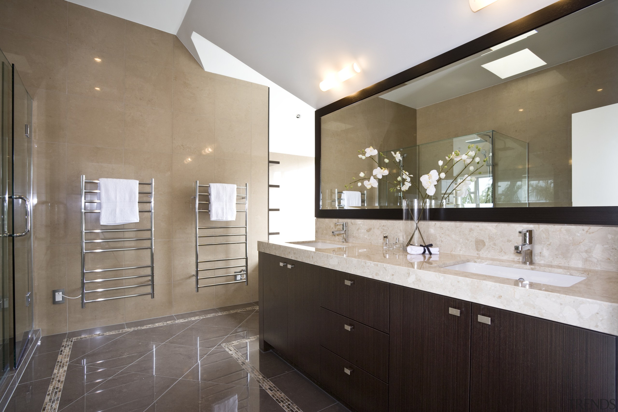 View of a bathroom designed by a Yellow bathroom, cabinetry, countertop, estate, floor, home, interior design, kitchen, property, real estate, room, sink, white