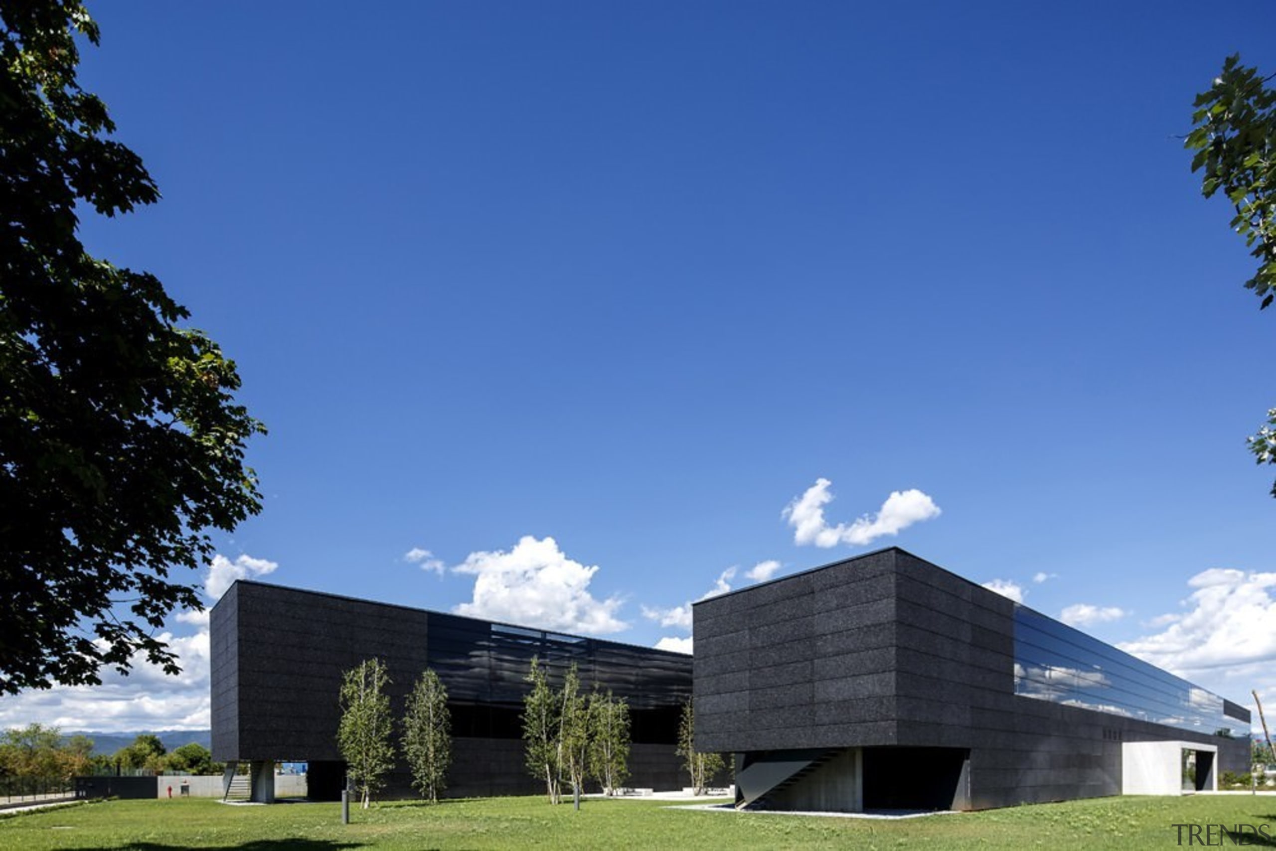 The new Faber headquarters designed by GEZA - architecture, building, cloud, corporate headquarters, daytime, elevation, energy, facade, grass, headquarters, home, house, real estate, sky, blue