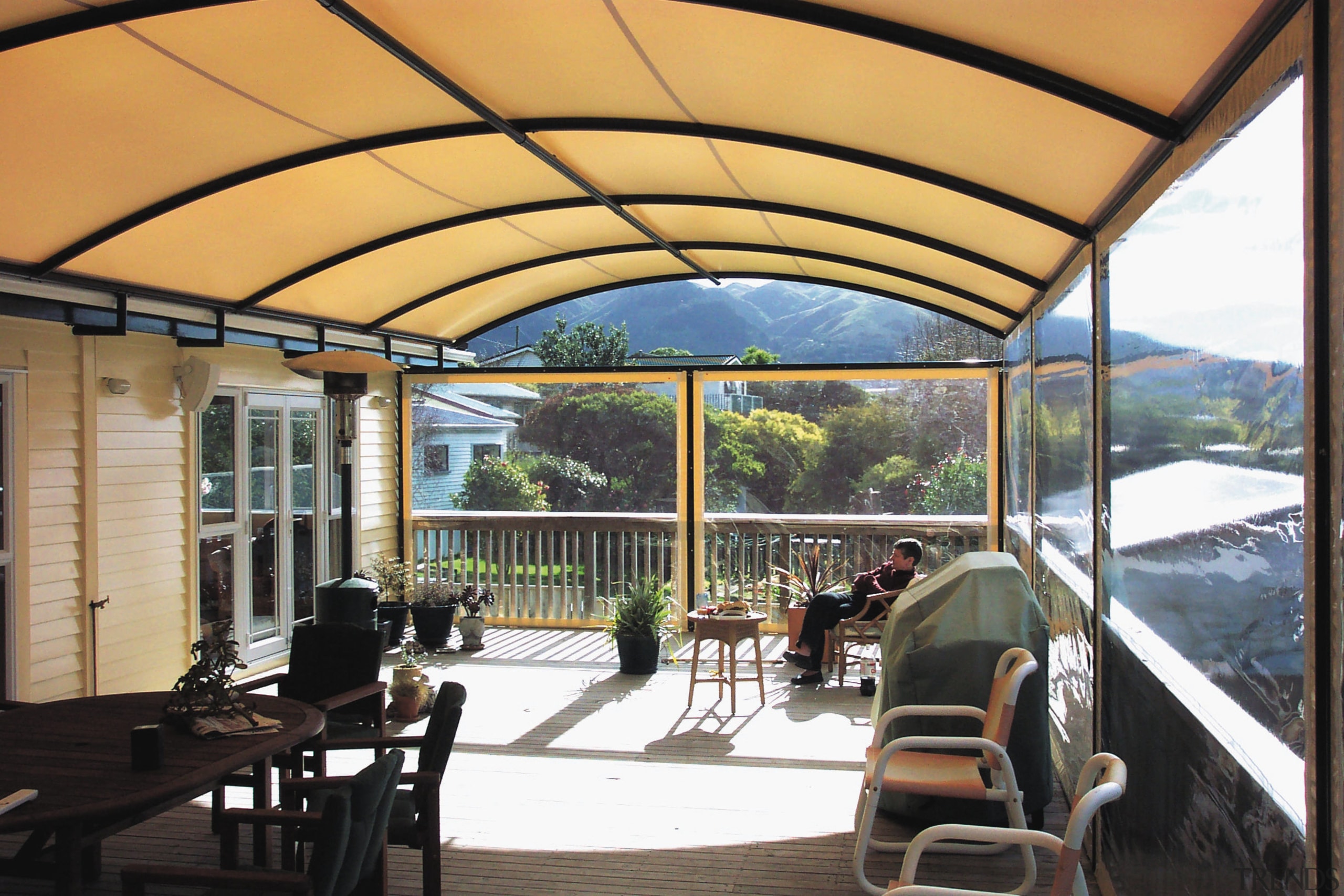 A view of a shade from Fresco Shades. canopy, outdoor structure, property, real estate, roof, window, orange, black